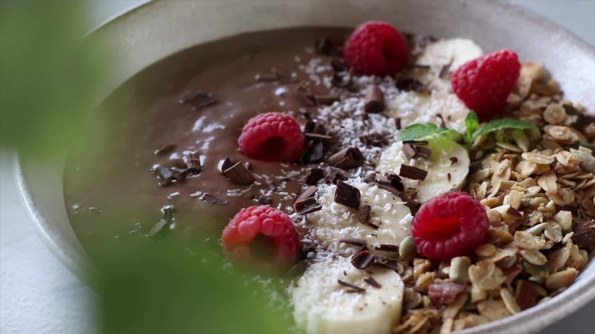Close-up of the chocolate banana smoothie with a straw