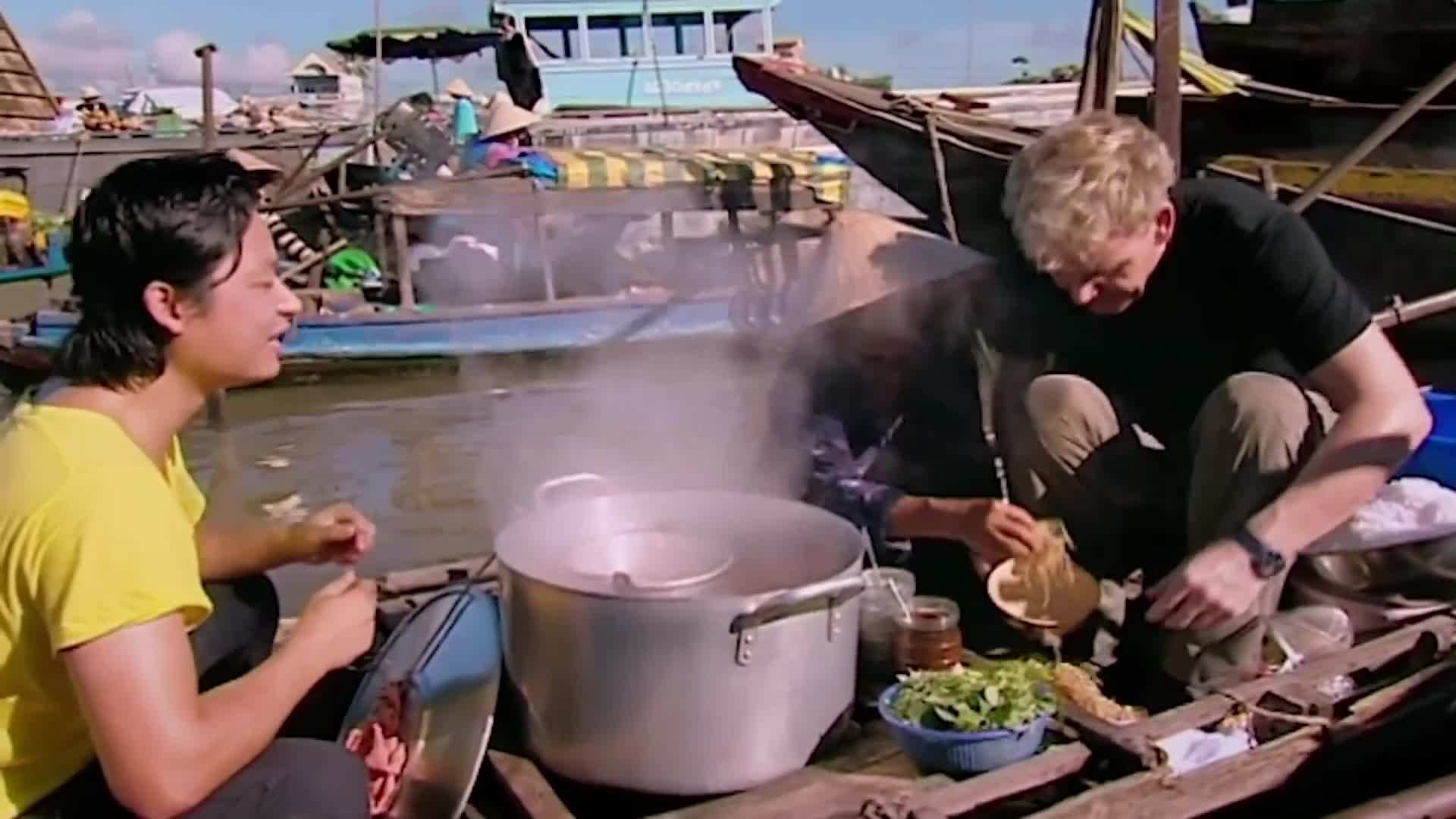 Enjoying a bowl of pho, a classic Vietnamese dish