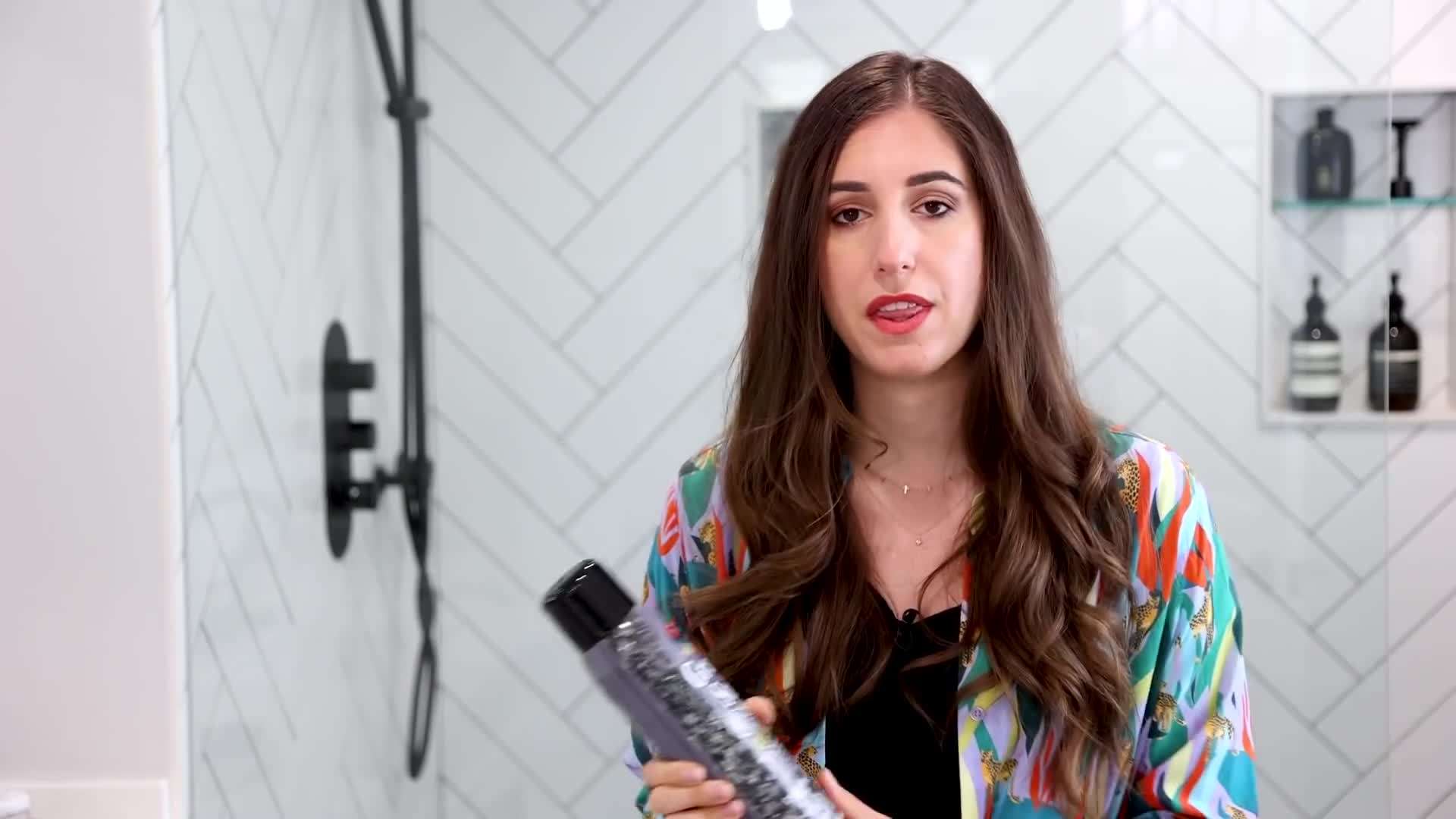 Using a toothbrush to remove tough stains from grout lines