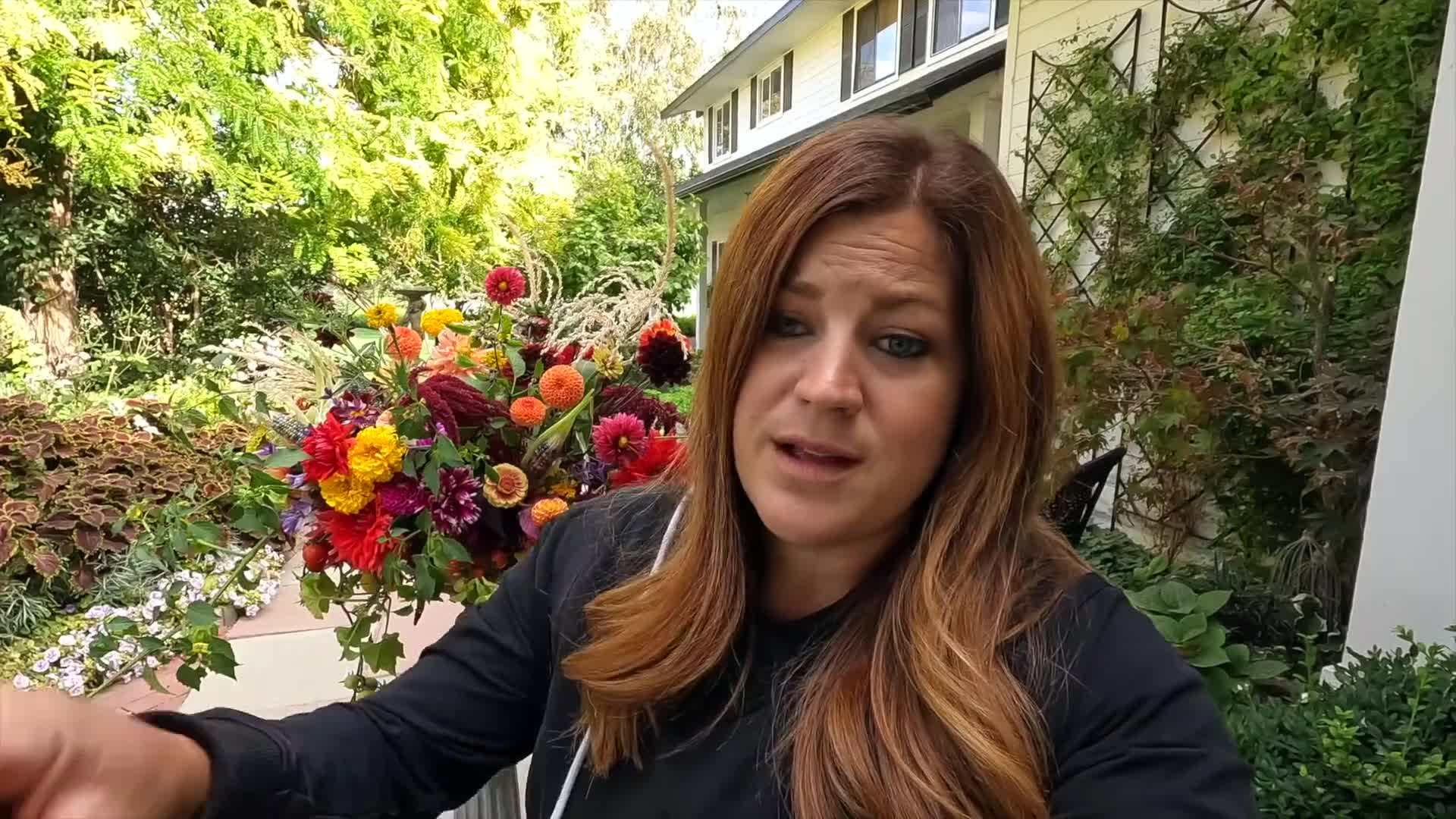 Pair of hands tying a ribbon around a bouquet