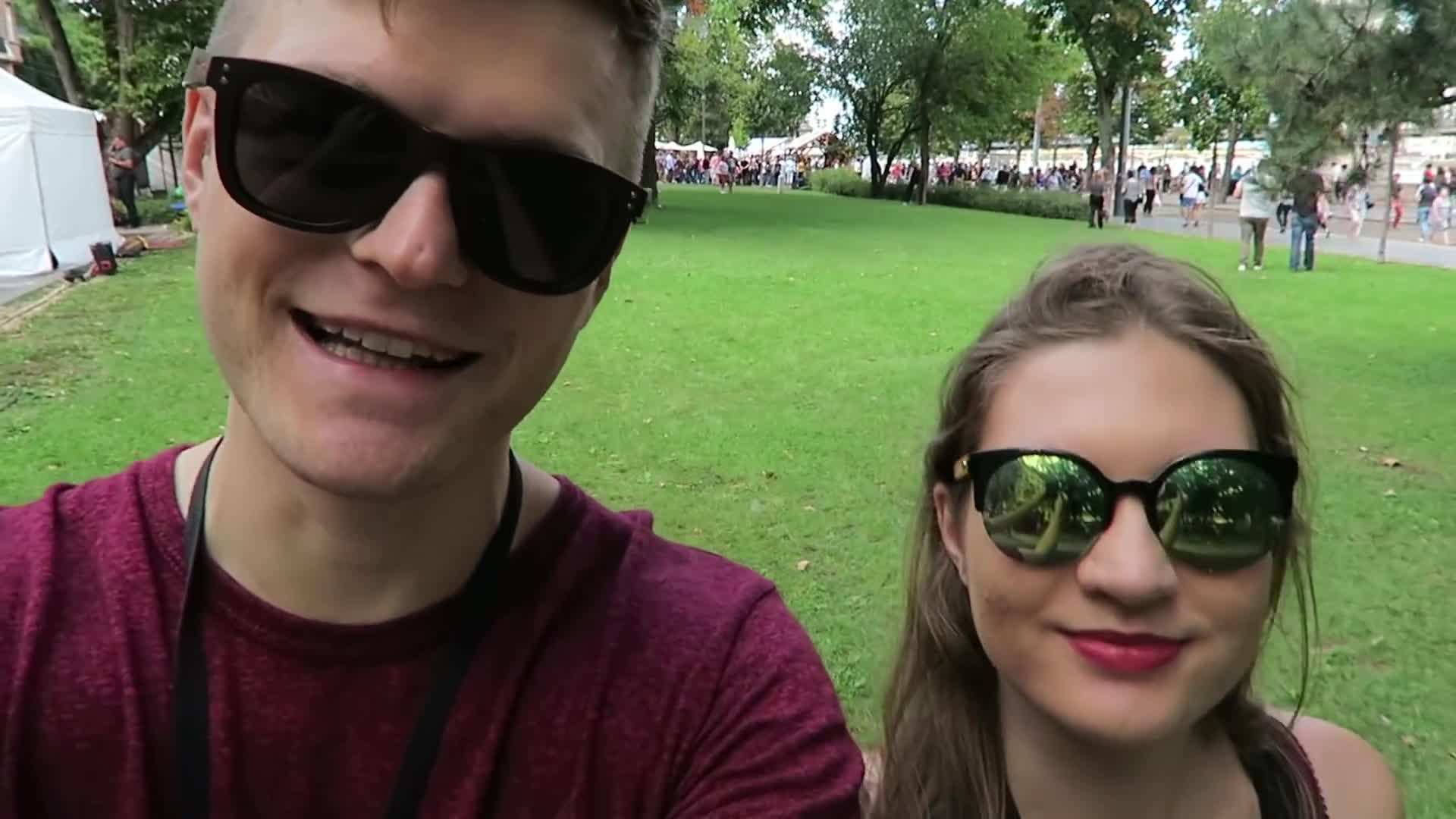 A vibrant street filled with food stalls offering traditional Hungarian delicacies.