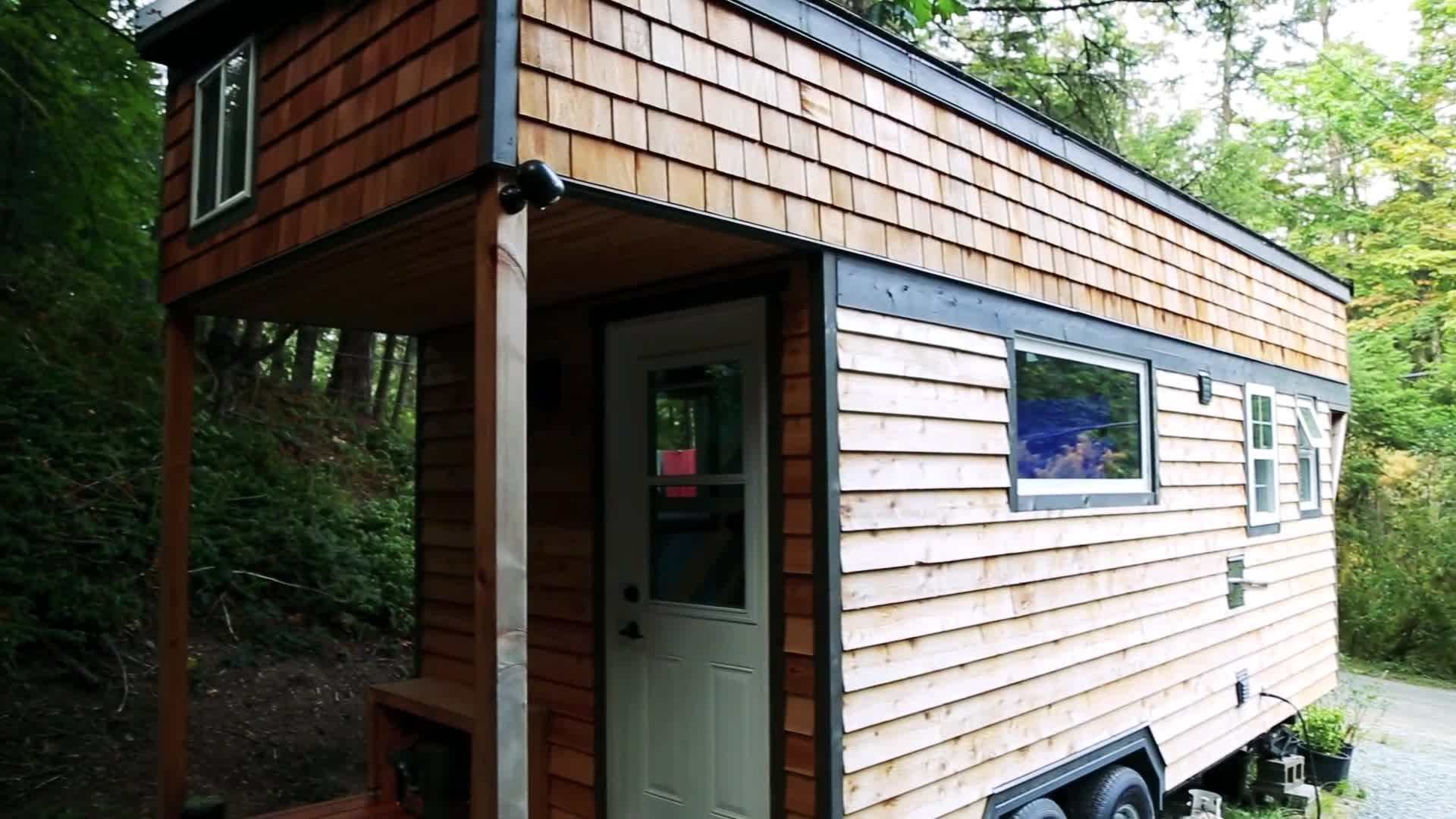 A tiny house with high ceilings and custom furniture