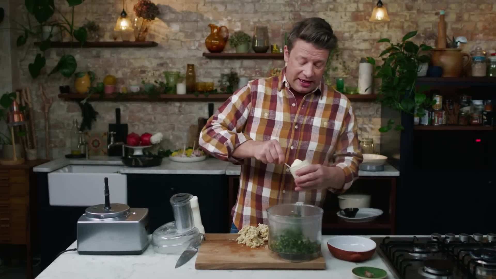 Chopped spinach being added to the creamy sauce