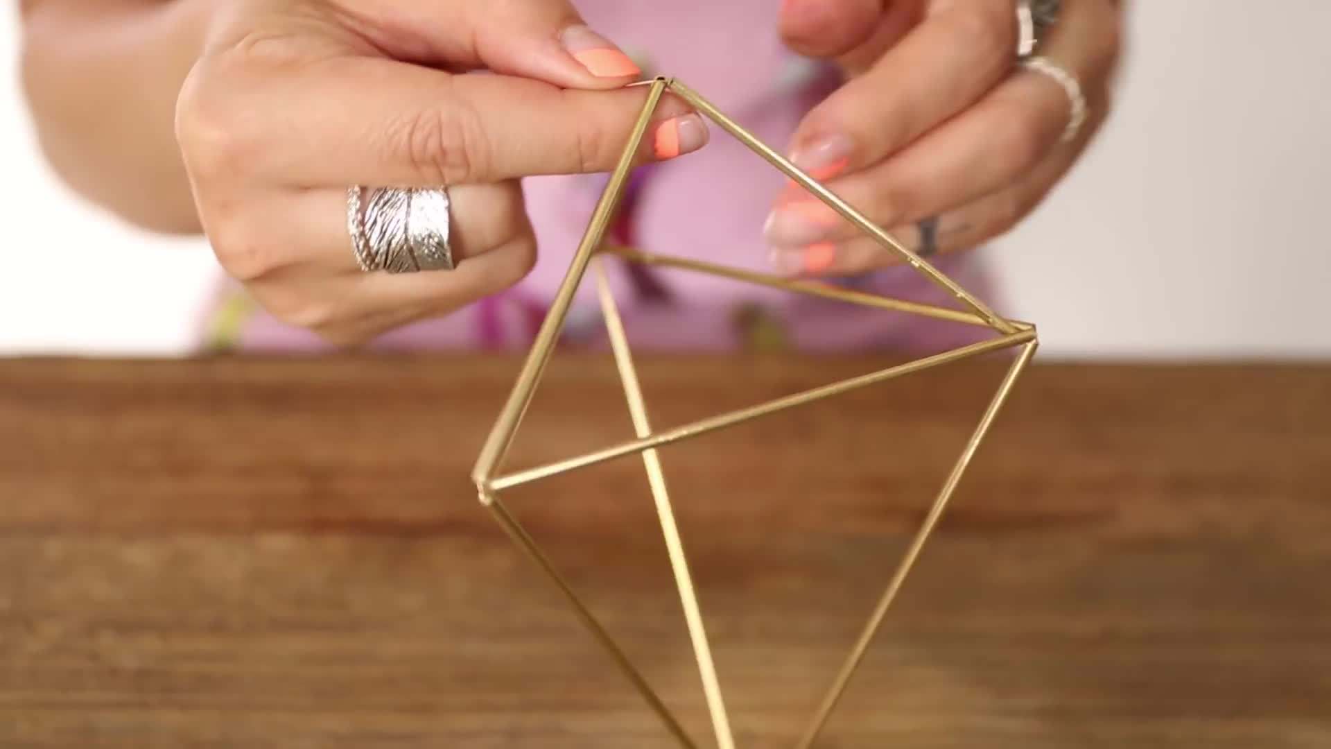 Spray painting the cages in a vibrant color