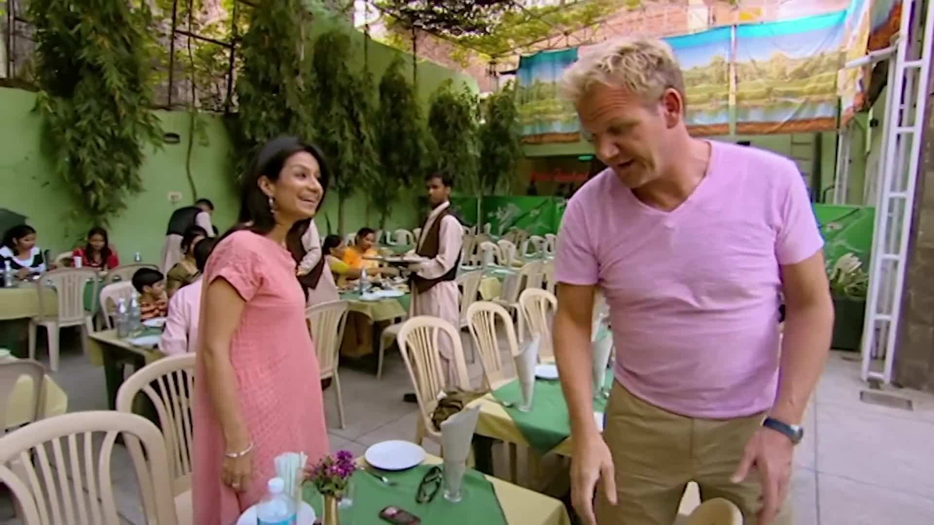 Gordon trying Vada Pav - a flavorful street snack in India