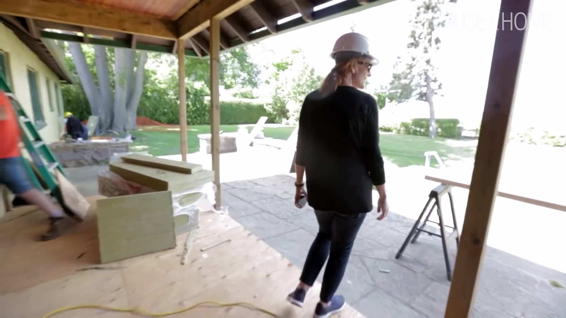 Reclaimed wood siding brings an authentic, weathered look to the exterior