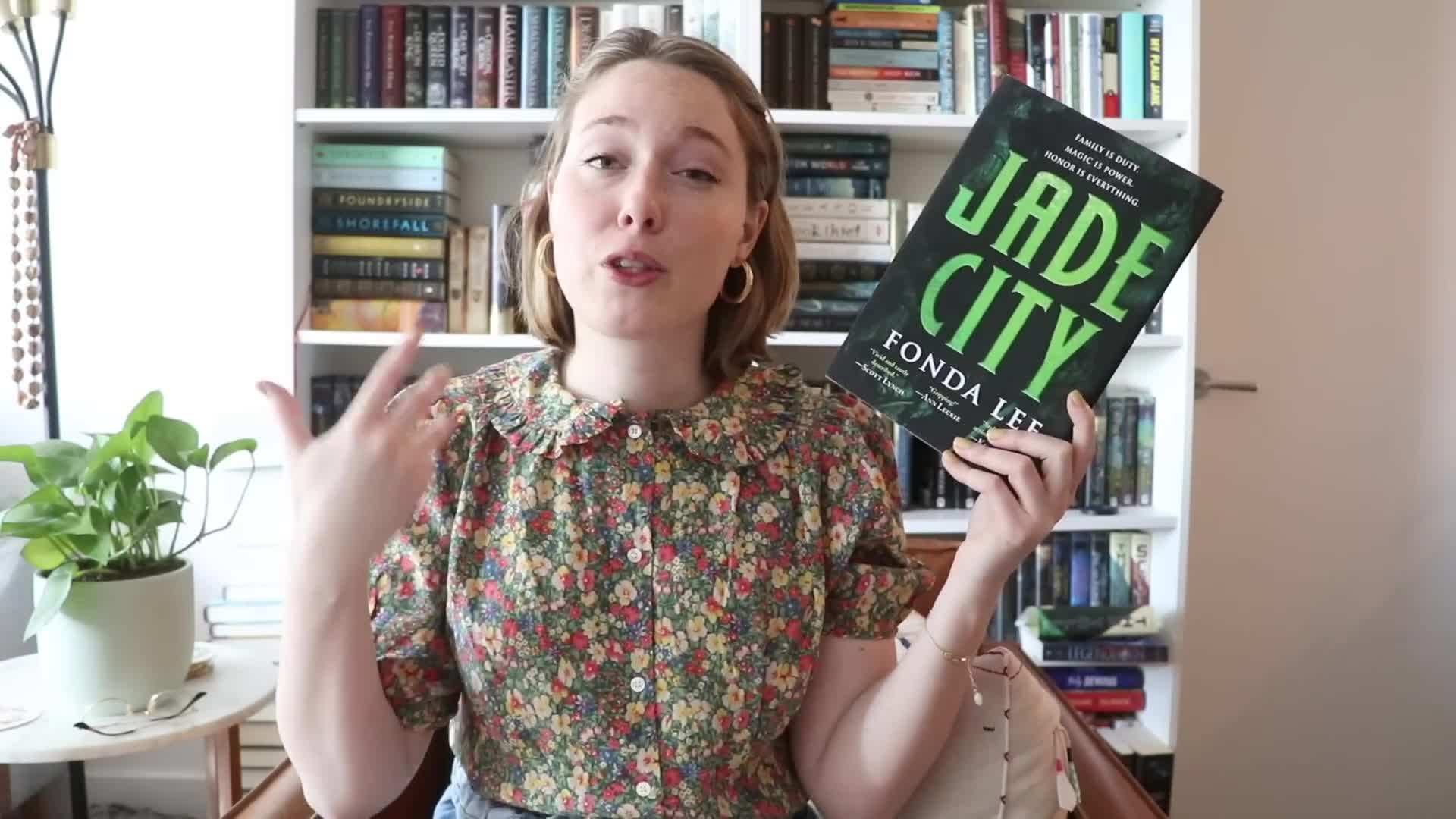 Cozy Reading Nook with Leaves Falling Outside