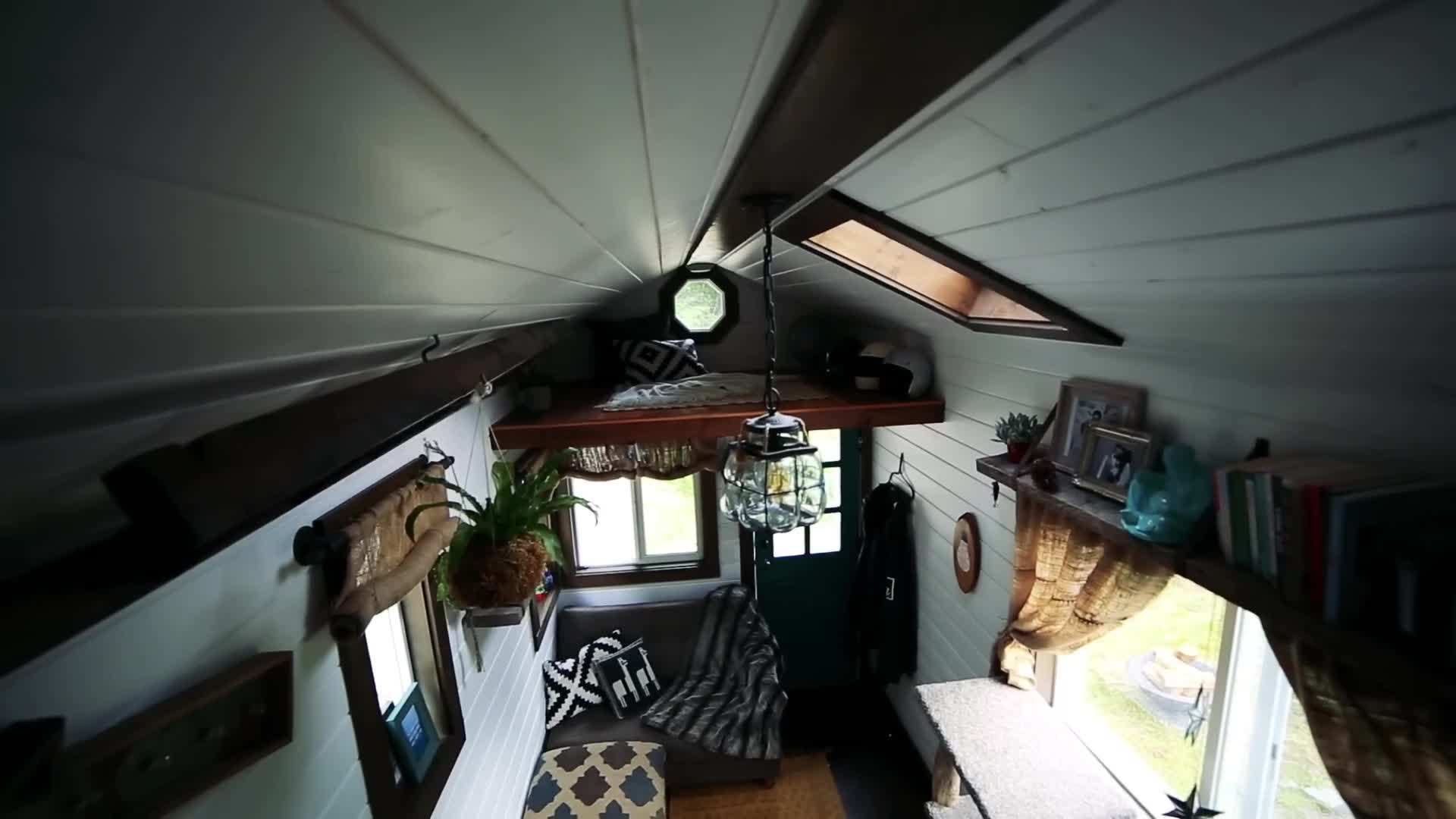 A cozy loft bedroom in a tiny house