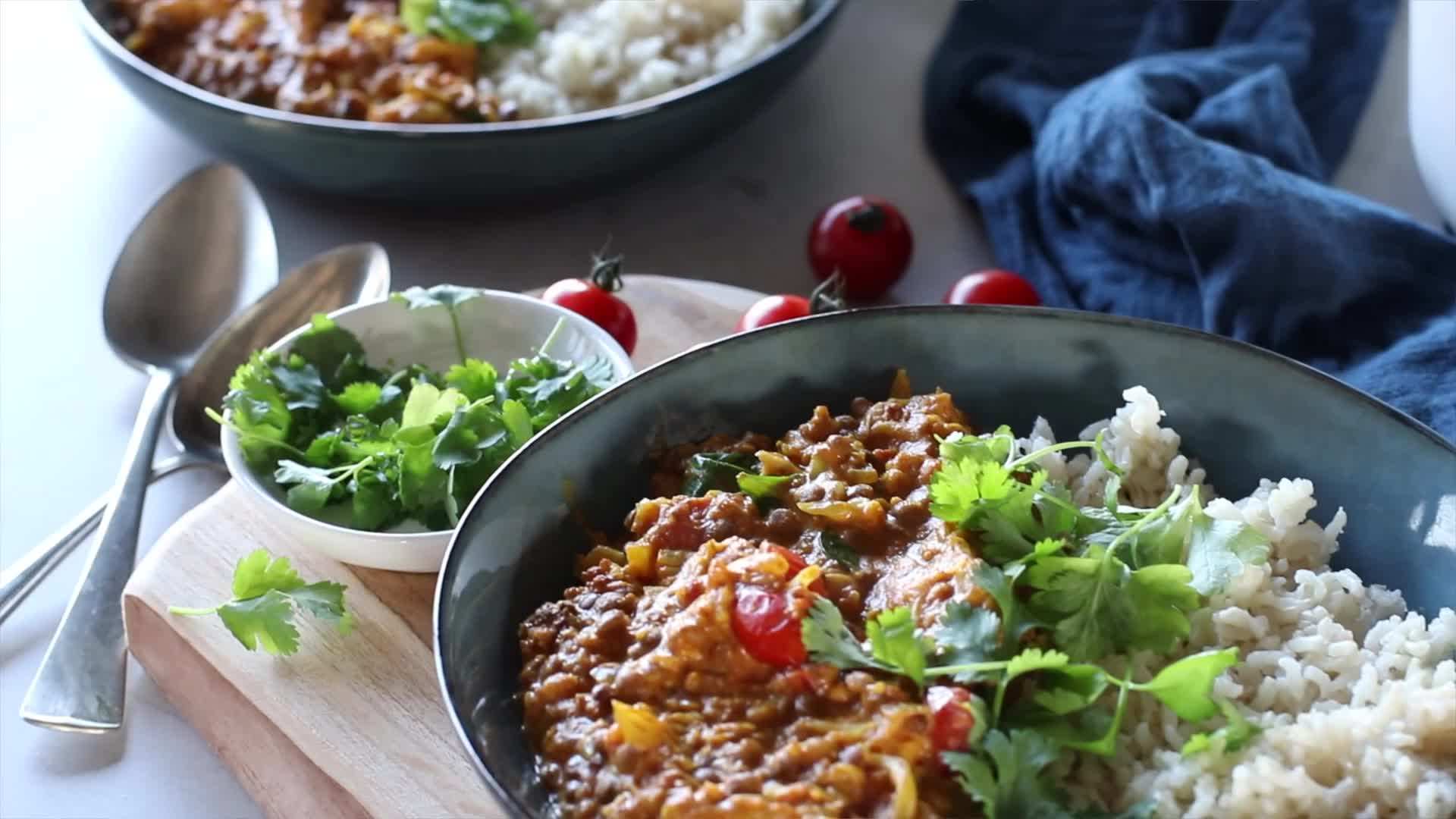 Buddha bowl with brown rice, steamed vegetables, and baked tofu