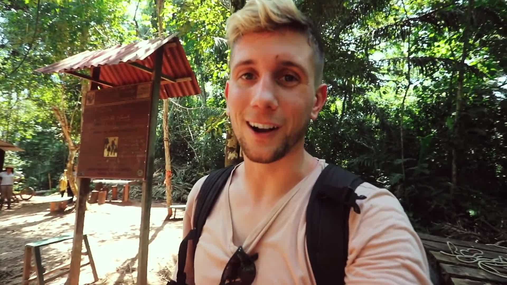 Boat sailing along the Amazon River, surrounded by dense foliage