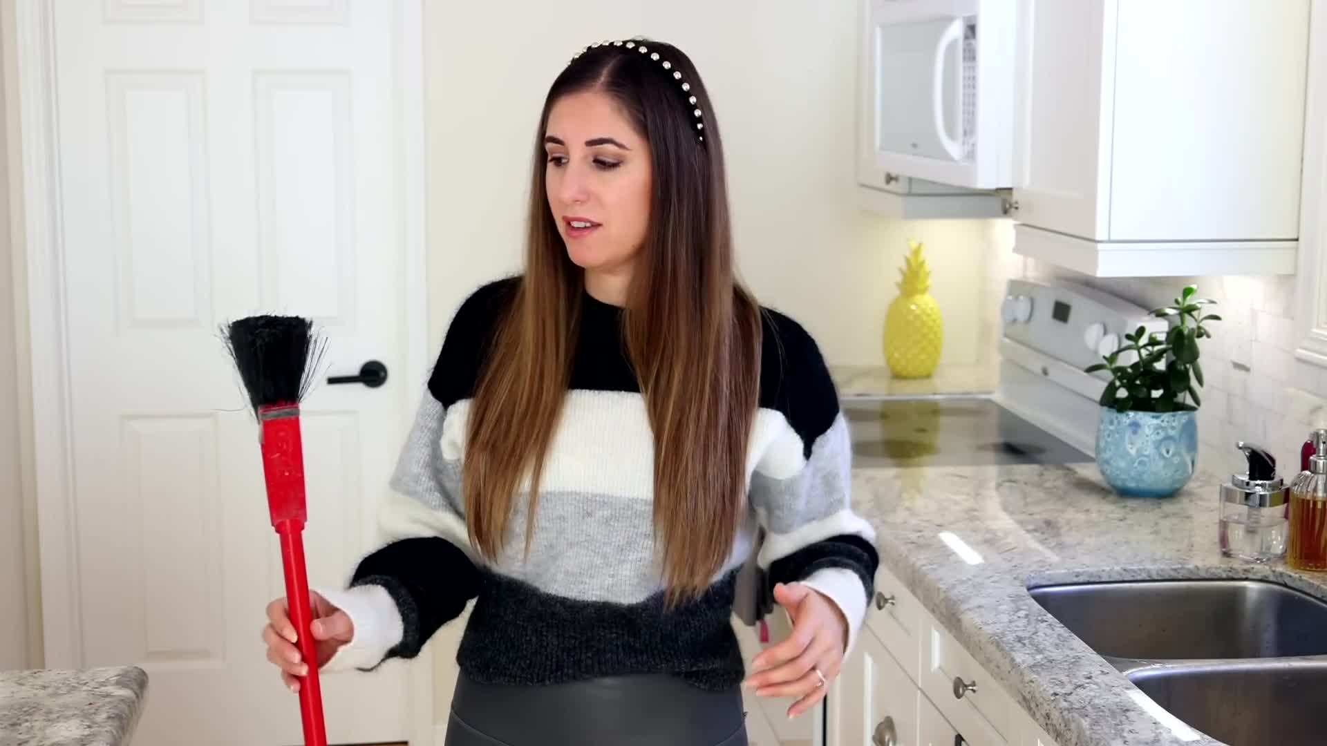 Cleaning Mop Head Under Running Water