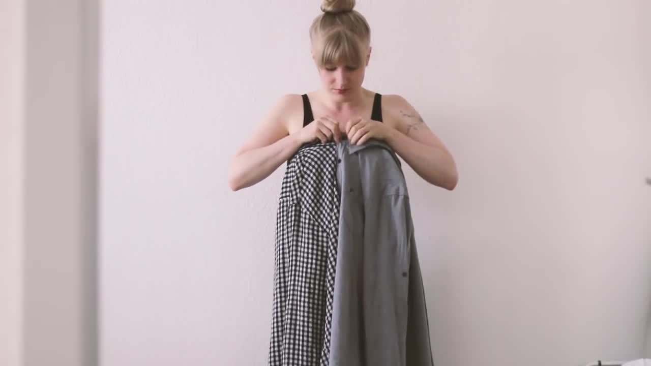 Trying on the shirt as a dress