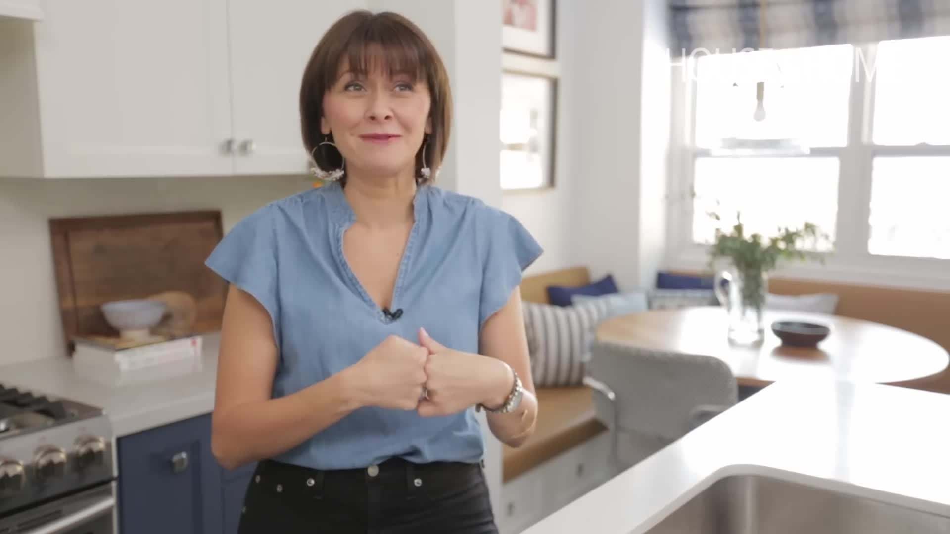 Blue kitchen cabinets painted in a navy shade