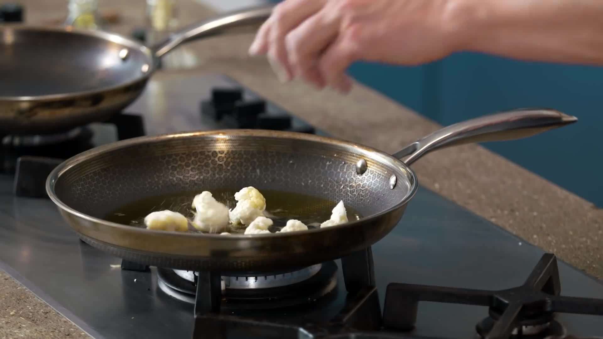 Cauliflower florets coated in spices ready to be roasted