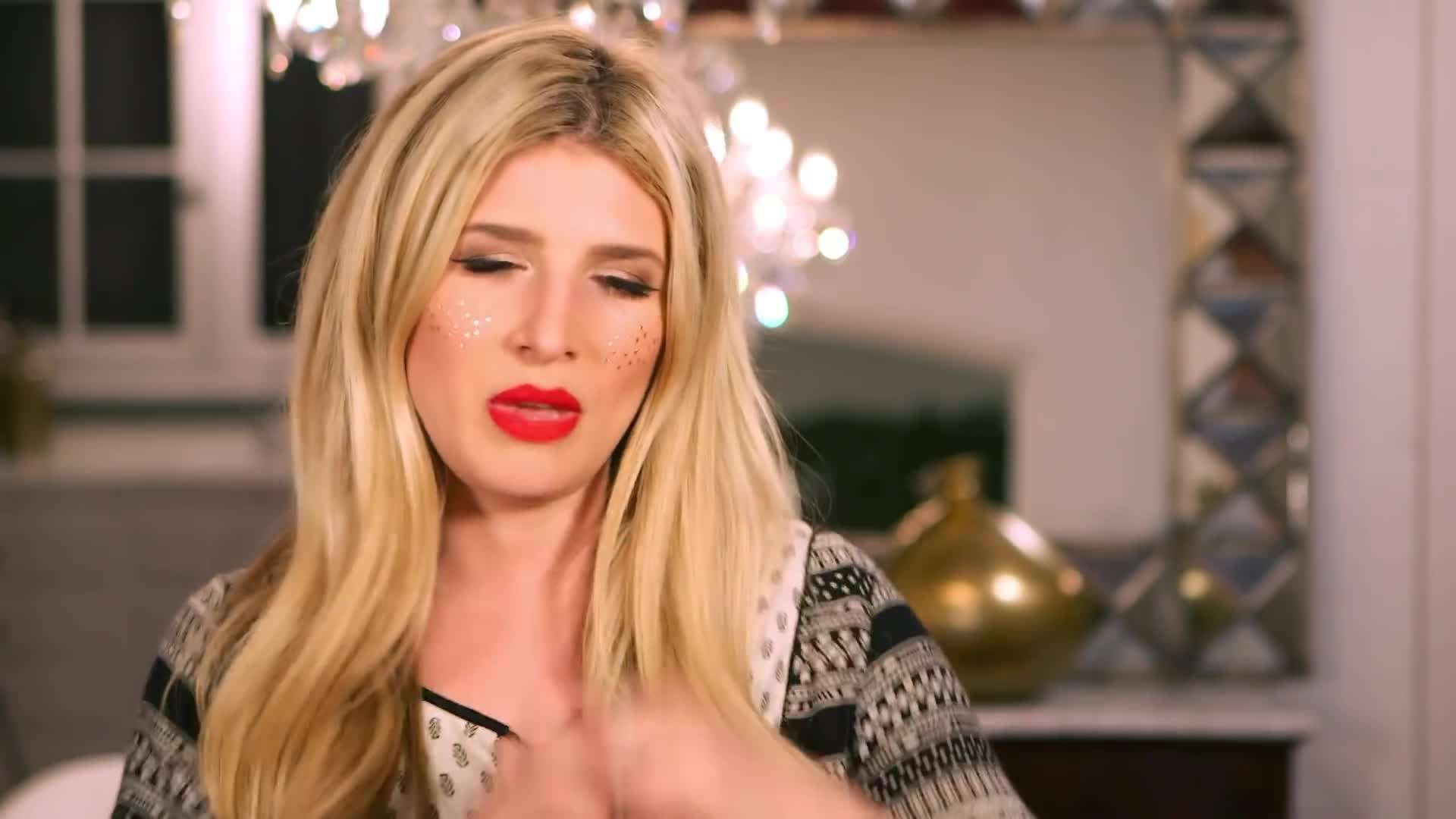 A homemade wreath with fresh evergreen branches and pinecones