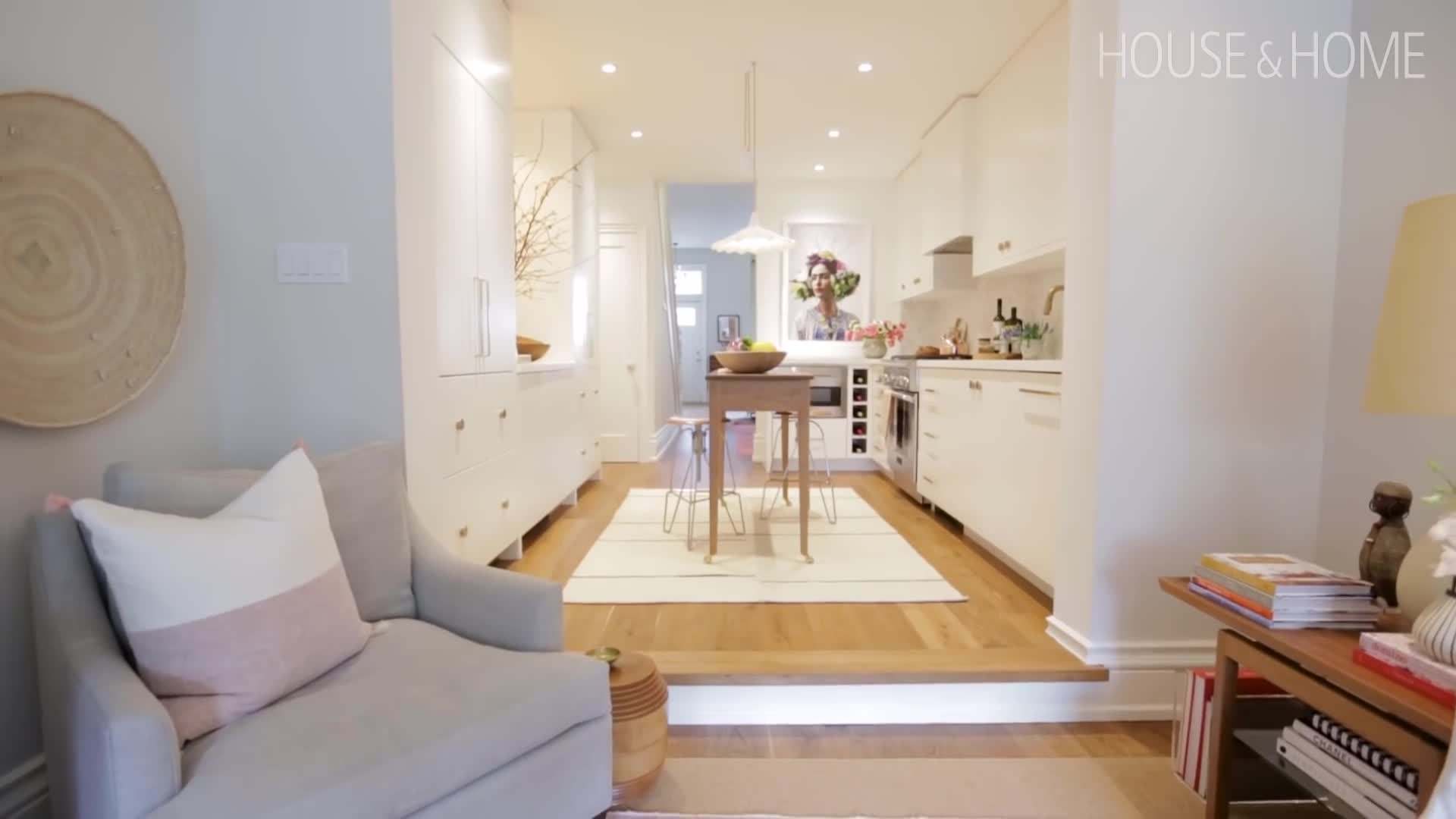 Stephanie showcases a close-up of her glossy white cabinets and marble backsplash