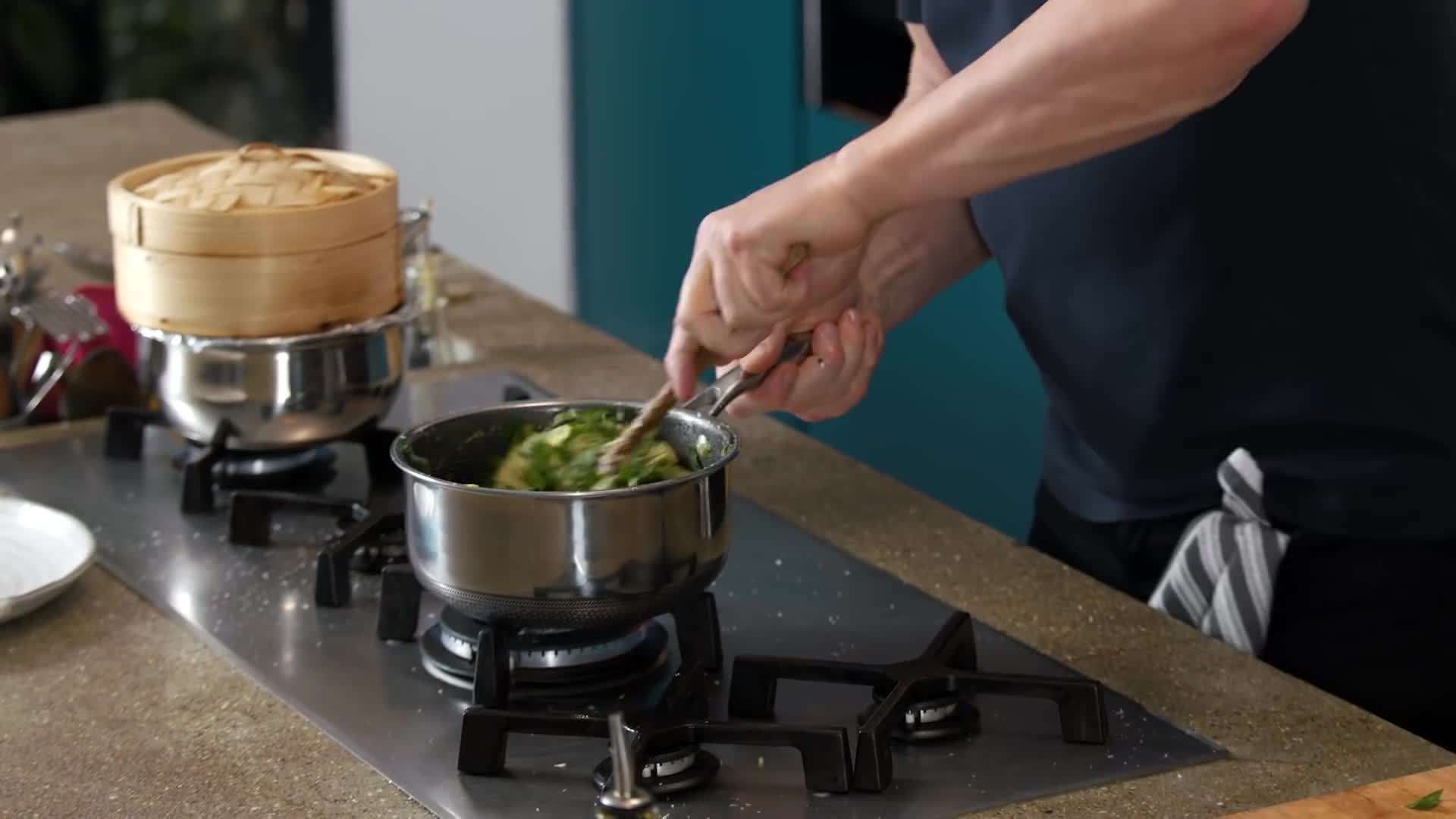 Gordon Ramsay plates the polenta dish with fresh herbs