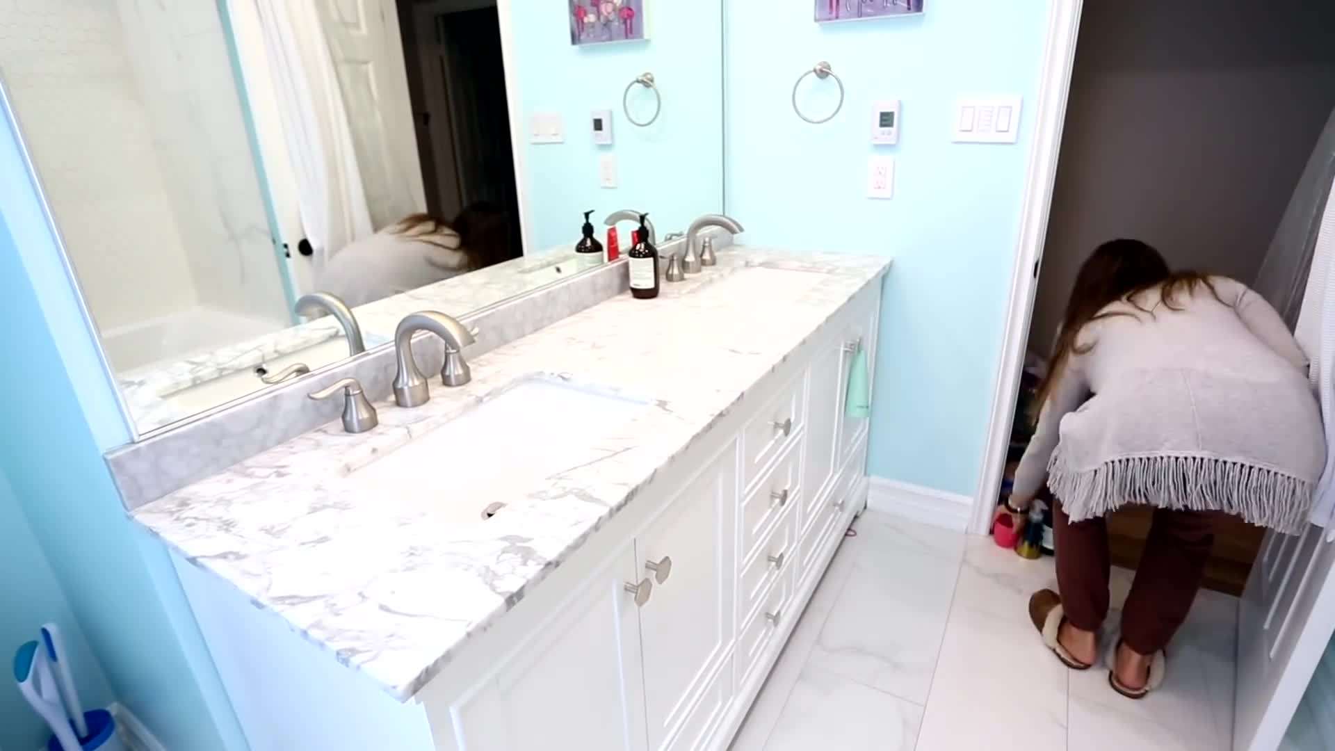 Organize your bathroom products in bins or baskets