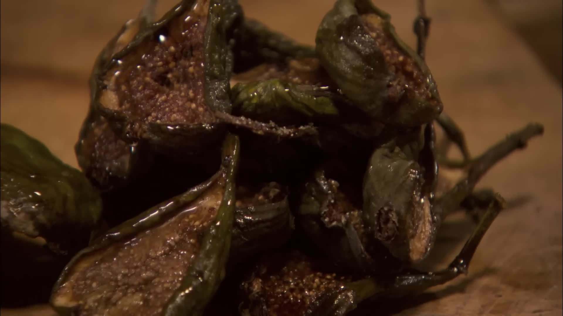 Plating the porchetta with roasted potatoes and a fresh salad