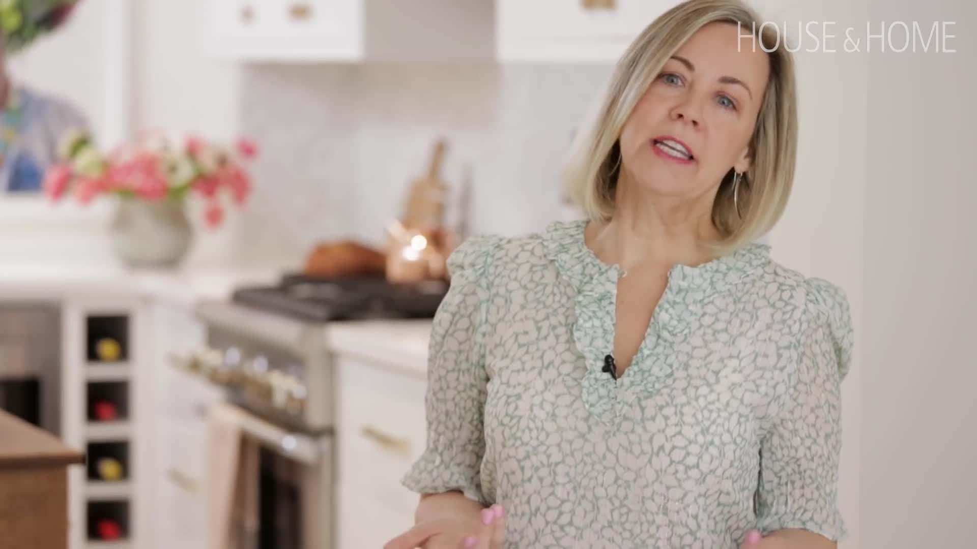 A shot of the kitchen with the striking art piece displayed on the wall