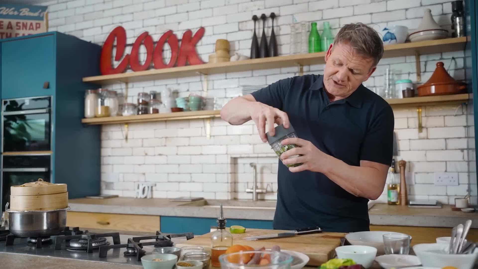 Pouring the mojo sauce over the chicken