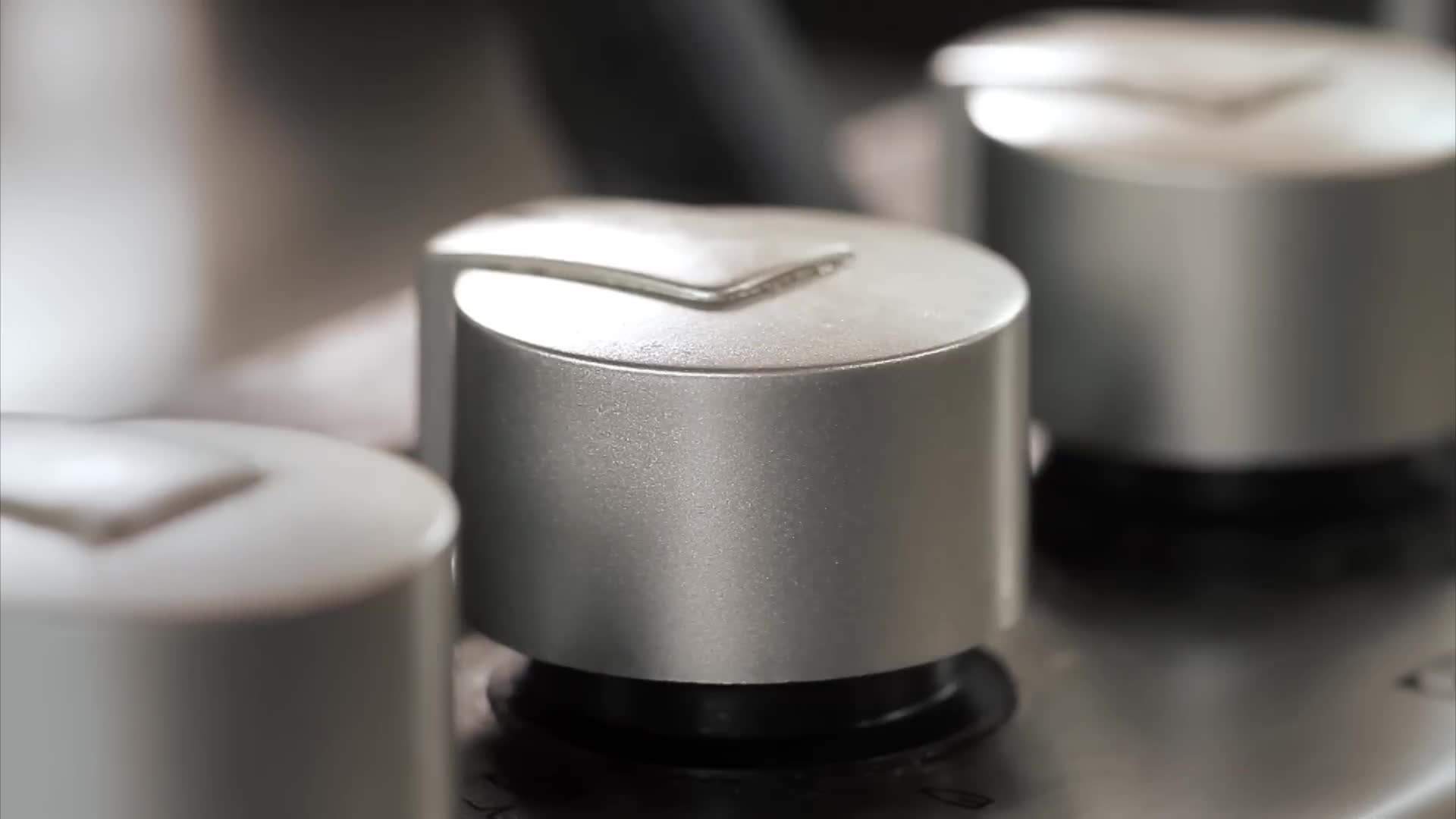 Cooked pasta being tossed together with the broccoli and sauce