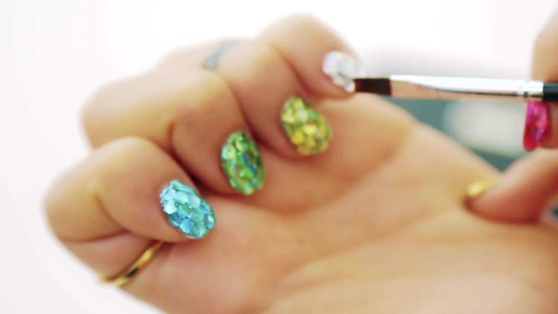 Apply thin layers of holographic nail polish