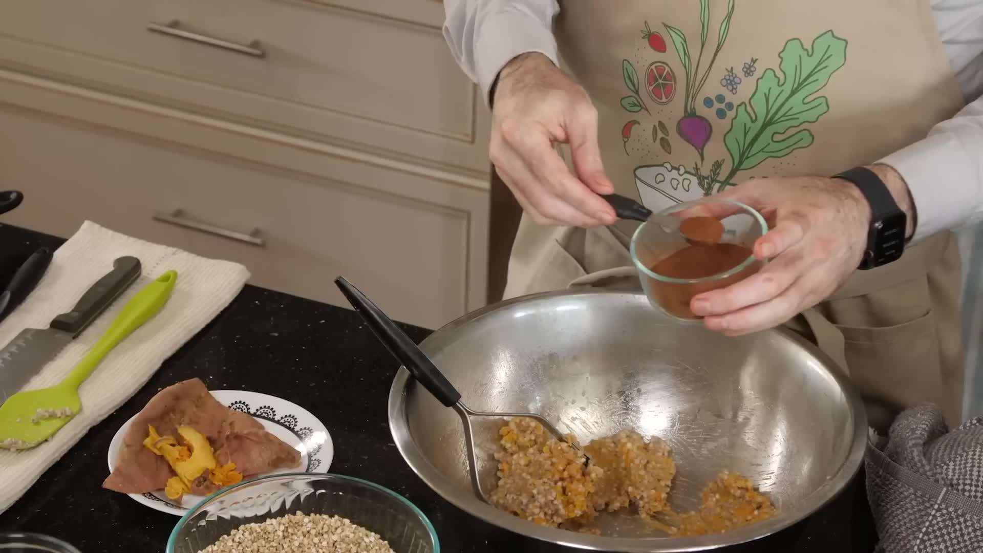 Mixing the ingredients for groatnola in a large bowl