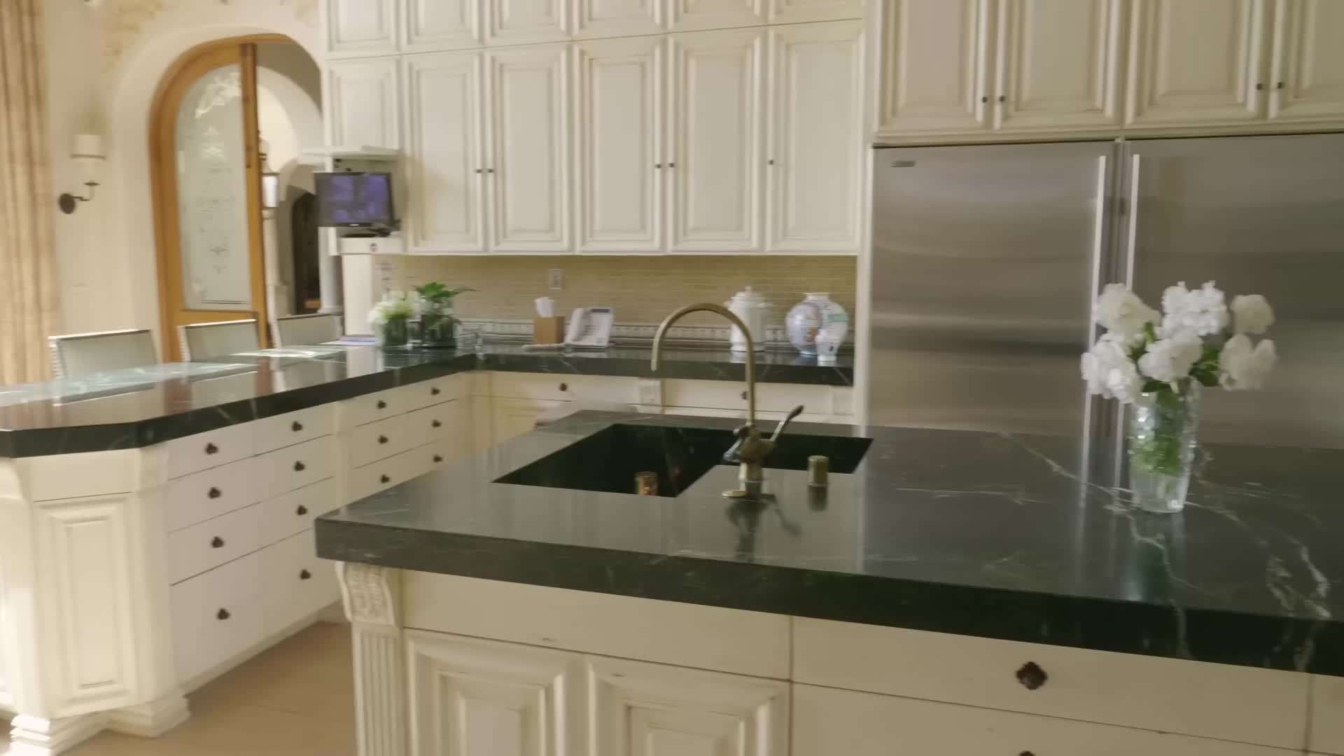 Gorgeous swimming pool surrounded by lush landscaping