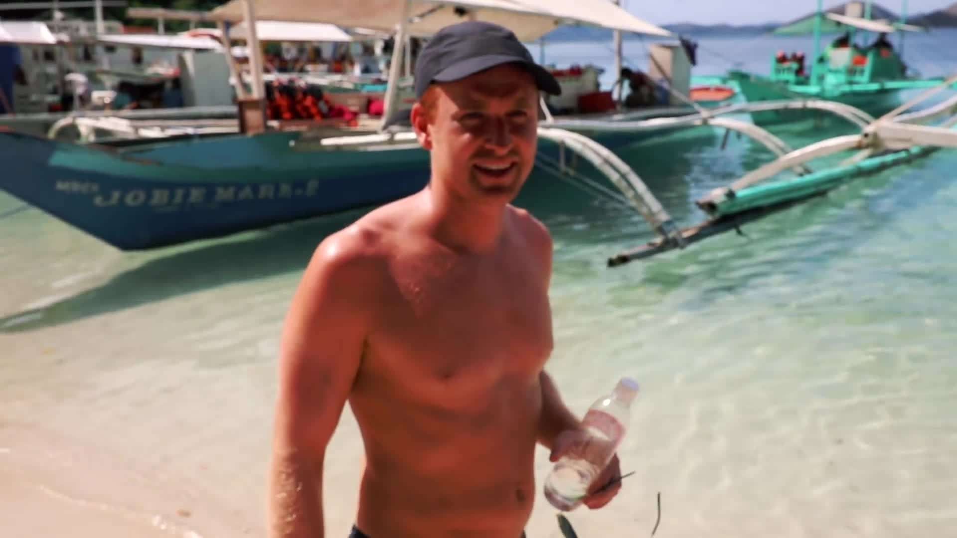 Glimpse of the white sandy beaches and lush greenery of Coron