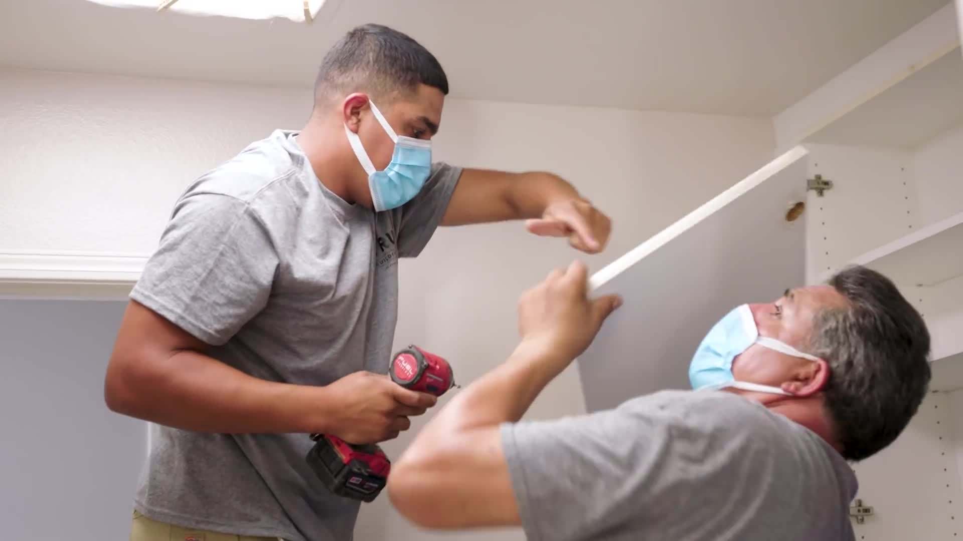 Organized laundry hampers and labeled storage bins