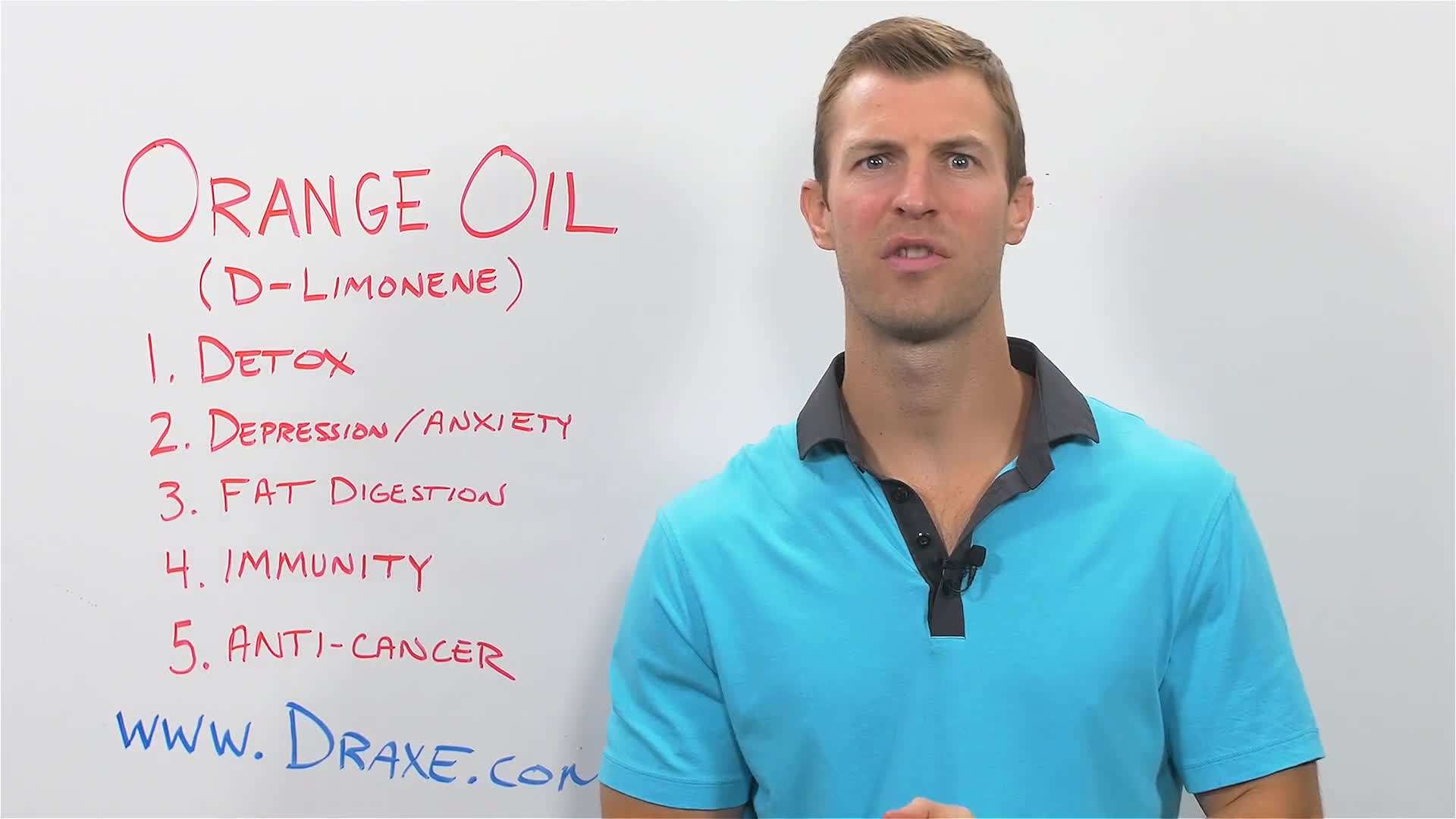 Orange fruits and orange essential oil bottles