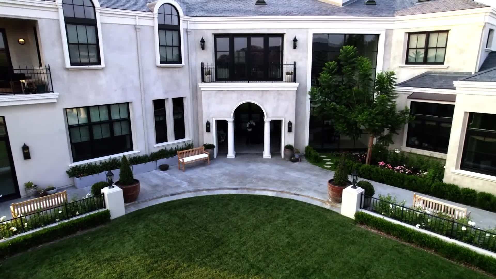 The grand entrance featuring a stunning chandelier