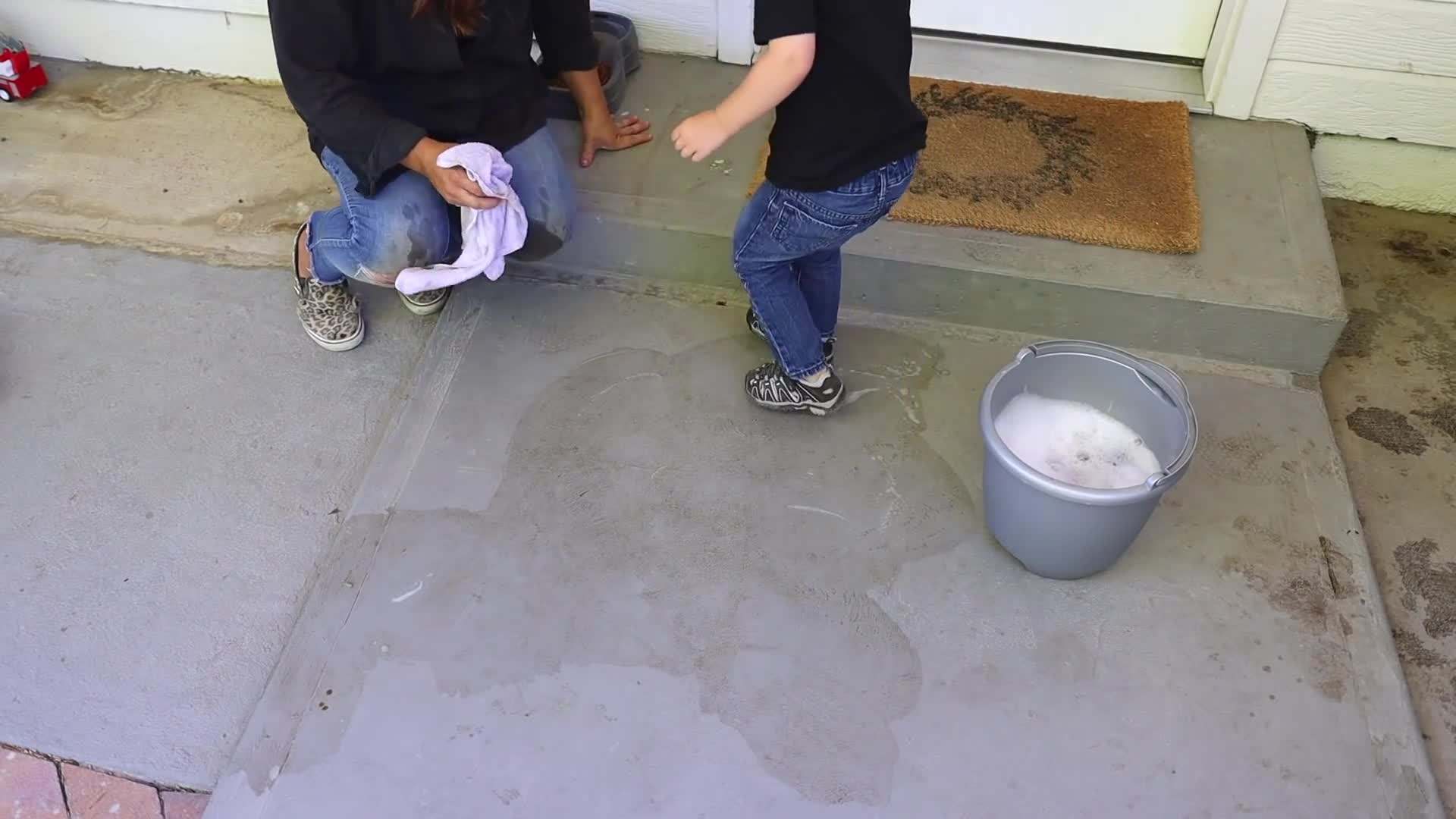 Removing a faded cluster of flowers from a rose bush