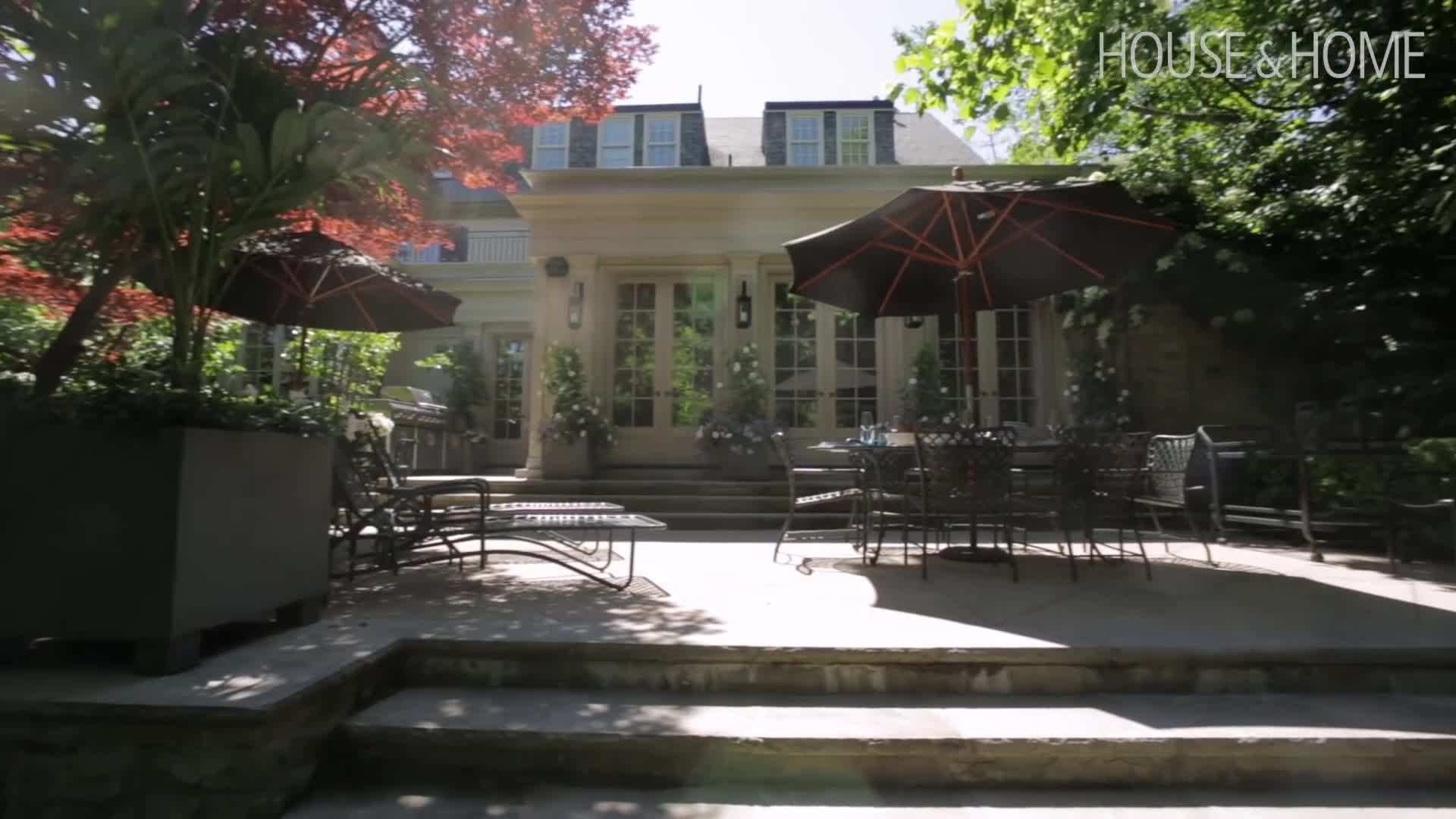 A pool surrounded by lush landscaping