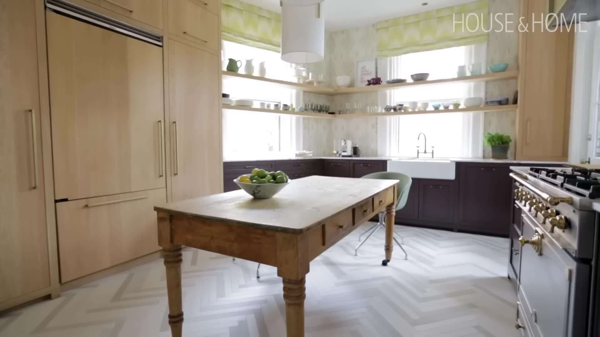 The kitchen with floating shelves in front of the window