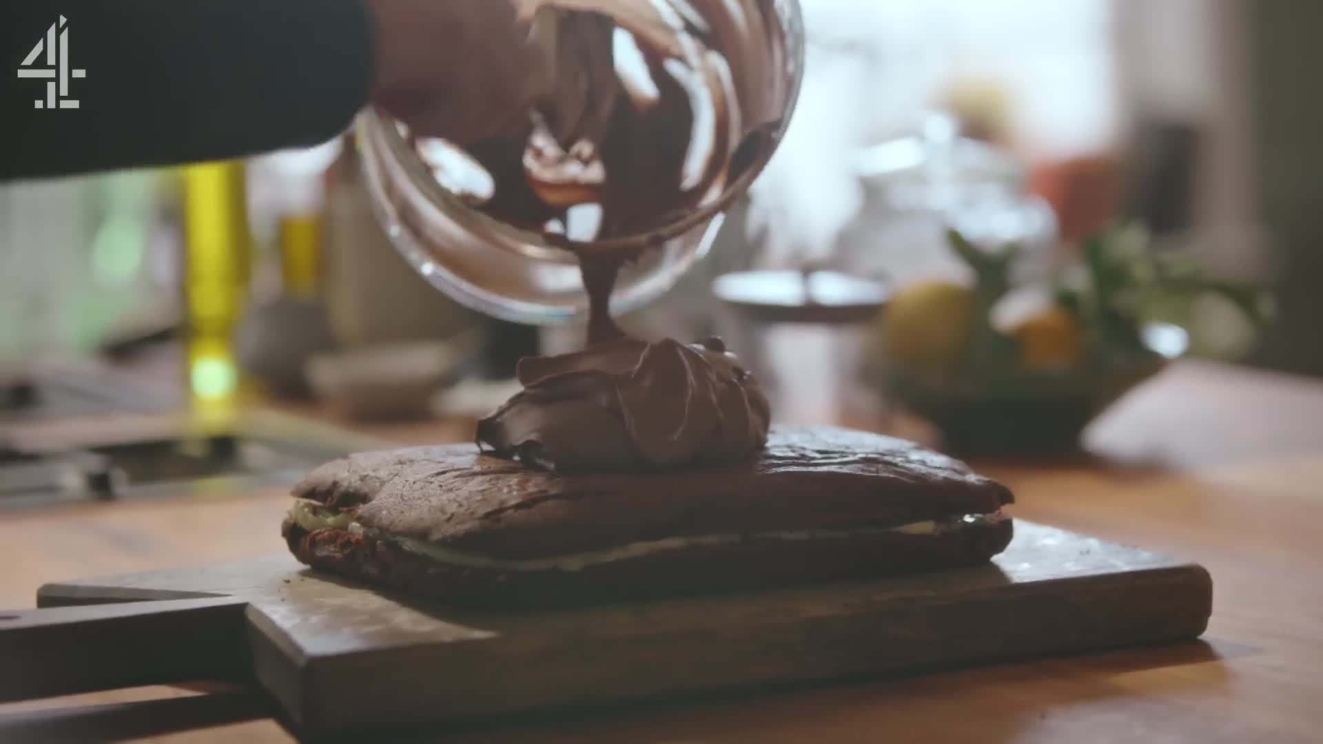 Spreading the chocolate buttercream on the sponge