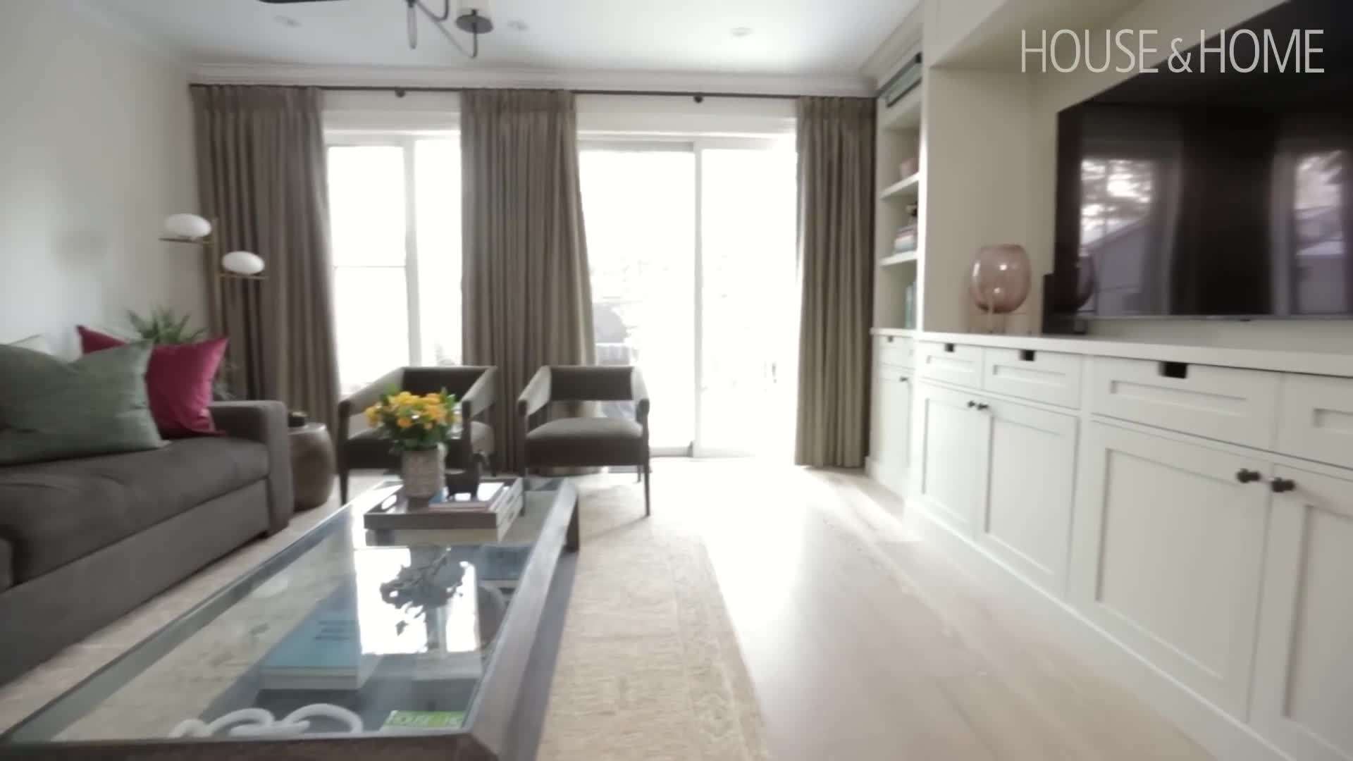A photo of the master bedroom with custom millwork and a neutral color palette