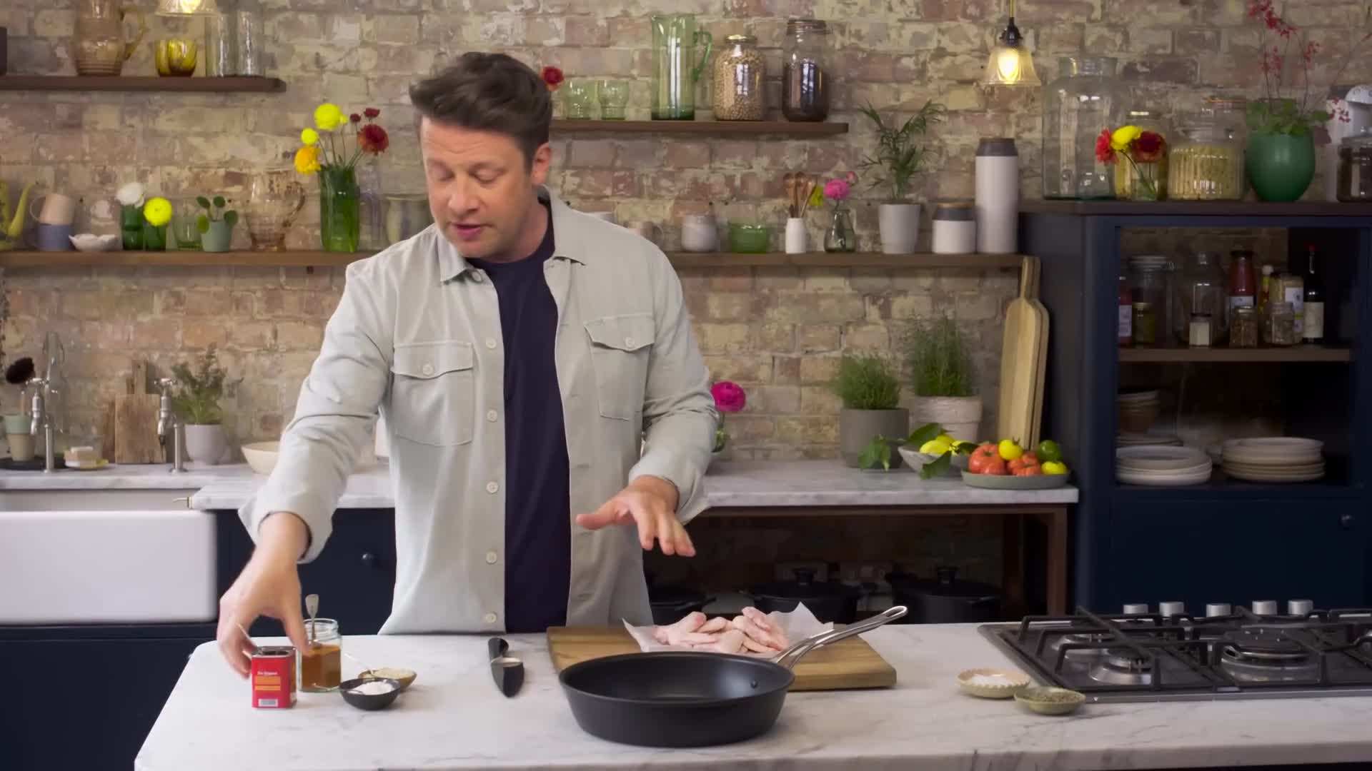 Jamie Oliver adding smoked paprika to the rub