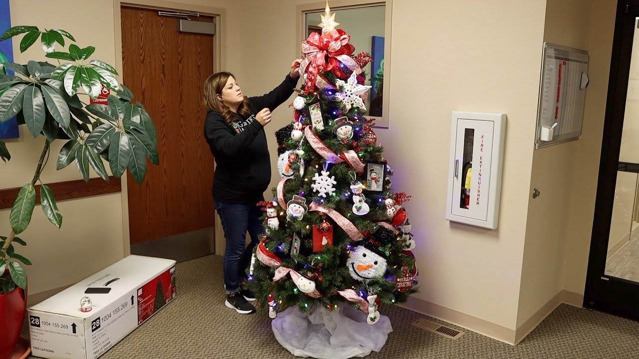 Decorating a Tree at The Children’s Relief Nursery: A Festive Project