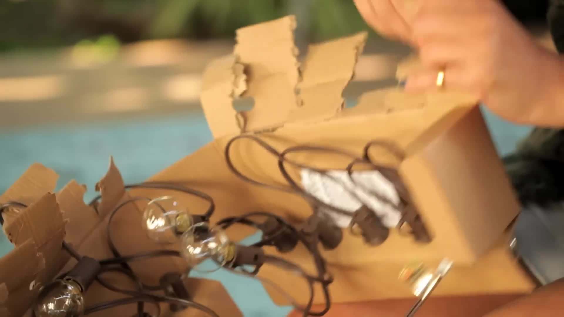 Stringing twinkle lights under the pergola