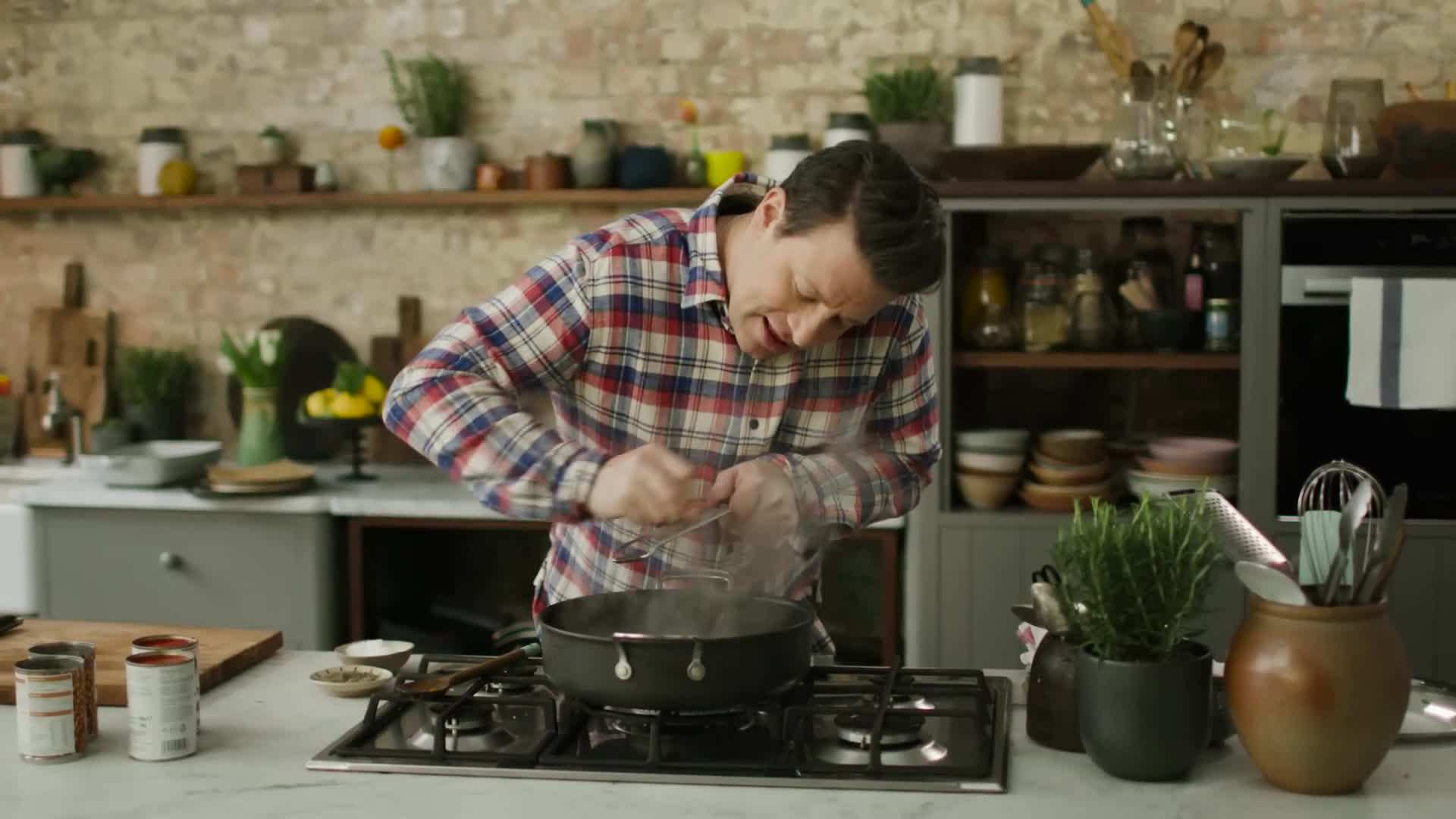 Adding red wine to the ragu for depth of flavor