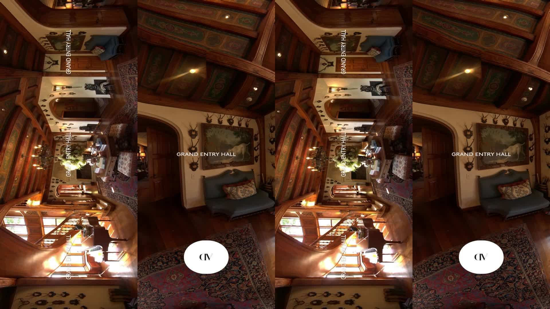 Bavarian horns and Persian carpet in the grand entry hall