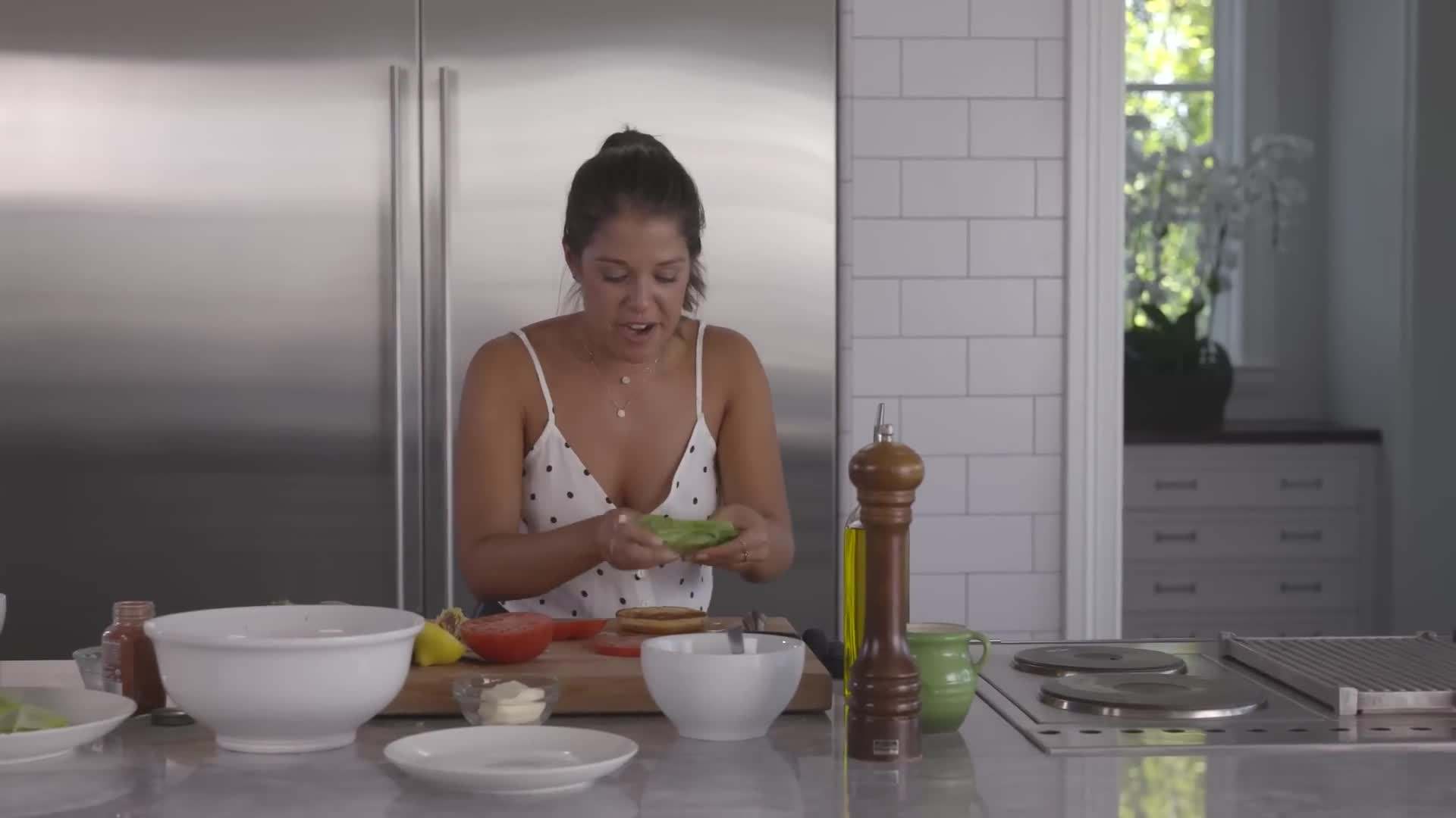 Layering the lettuce on the bun