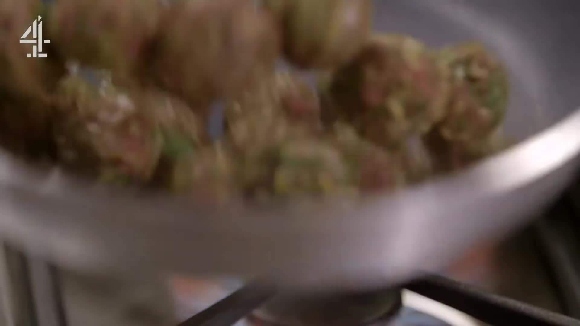 Frying the meatballs until golden