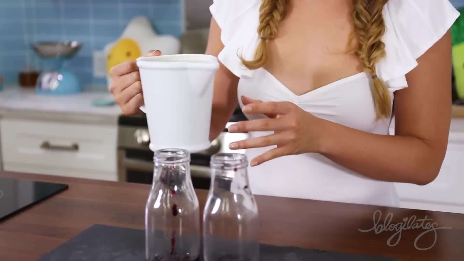 Layering Blueberry Jam in the Milk Jars