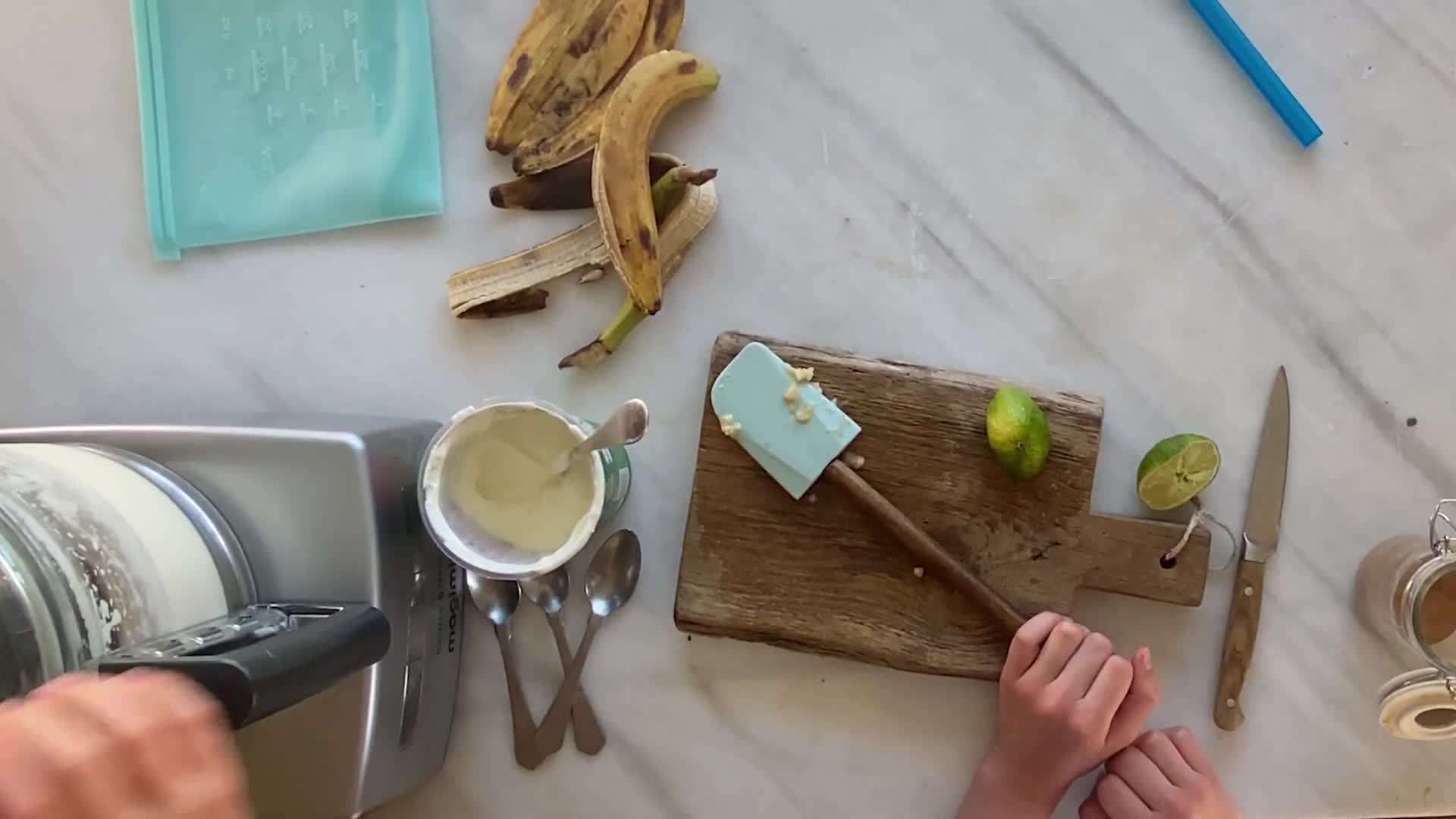 Mixing yogurt with blended bananas