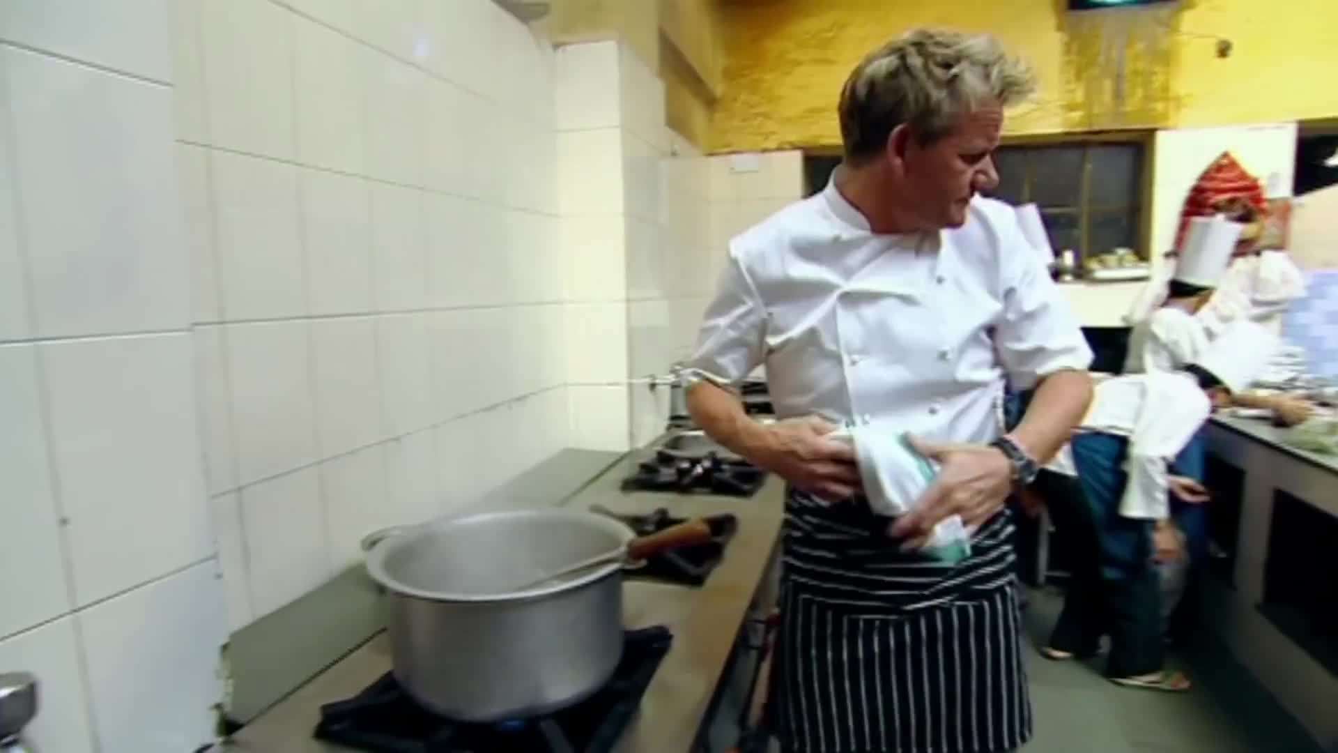 Gordon Ramsay preparing slow-cooked chicken with aromatic spices