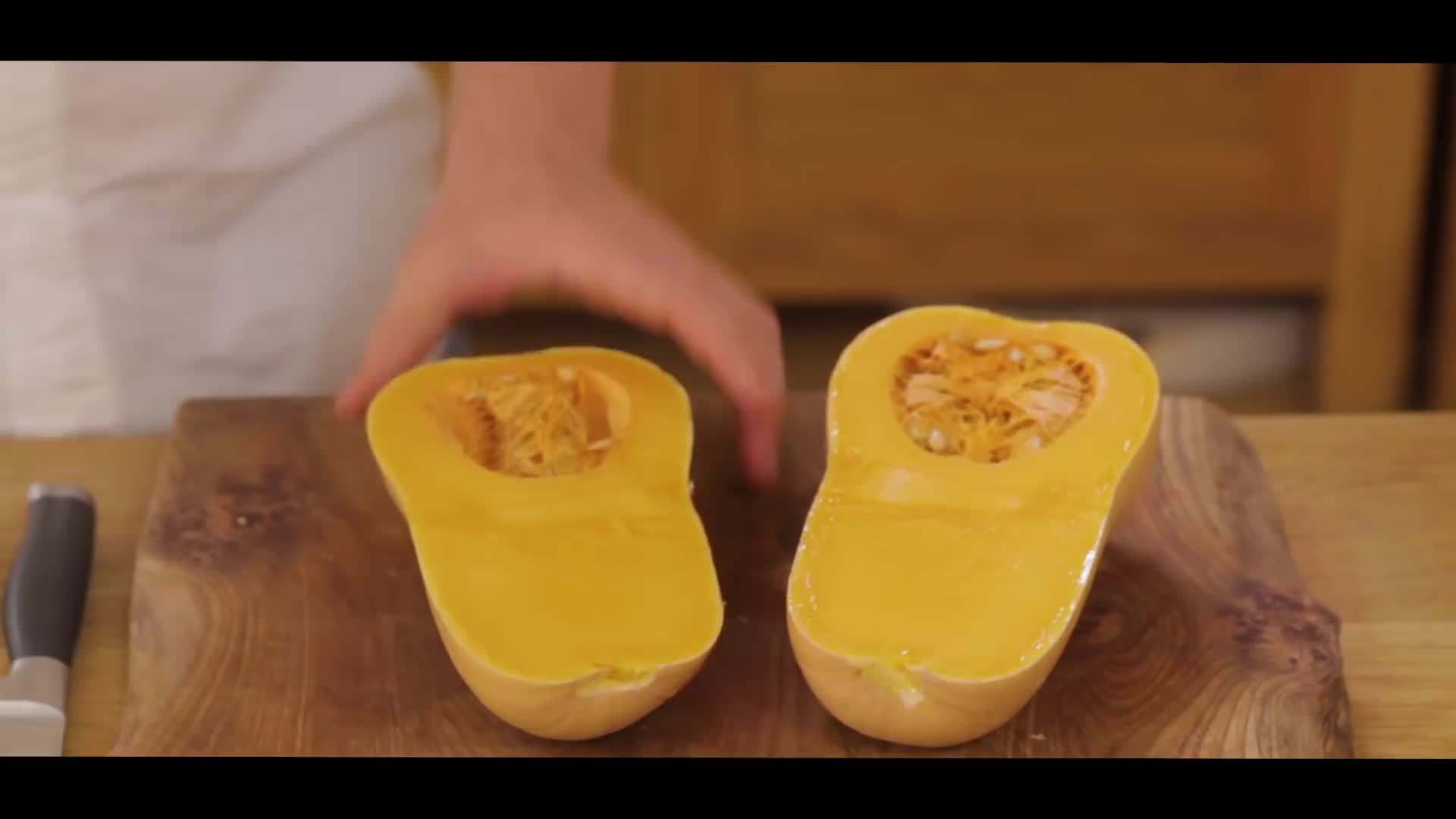 Using a knife to peel and slice squash or pumpkin