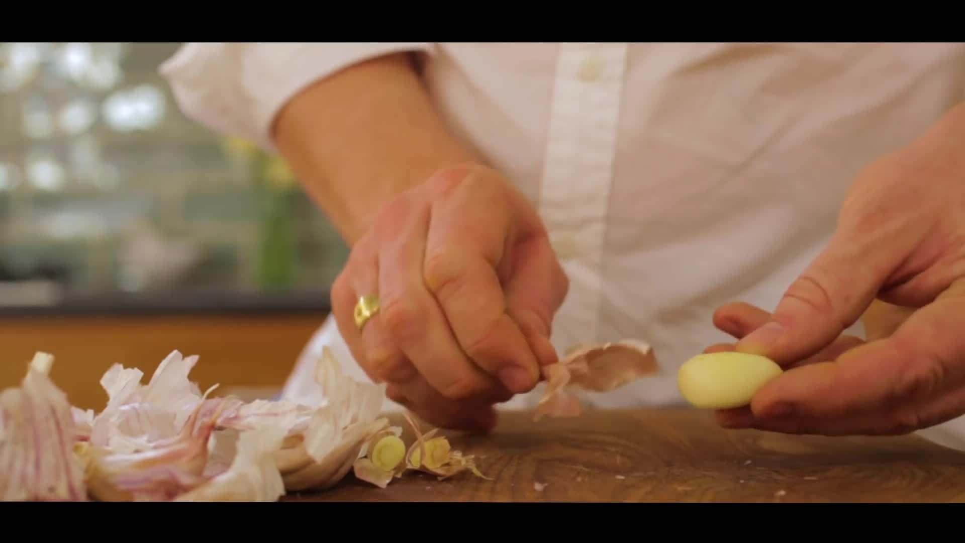 Using a rubber glove to peel garlic cloves